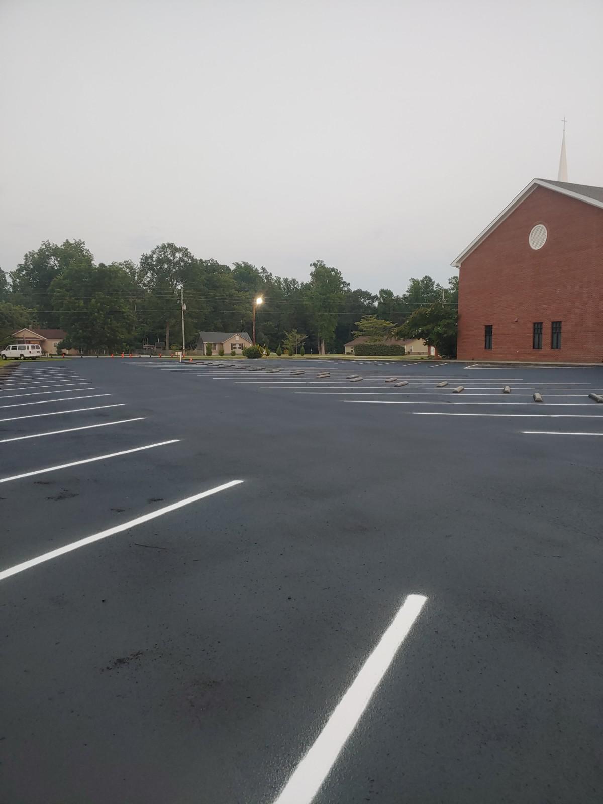 A parking lot with new line striping work done.