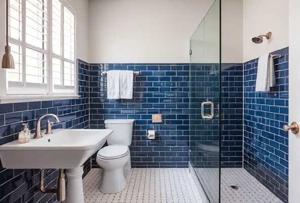Beautiful bathroom with navy tile accents and white fixtures, spa design