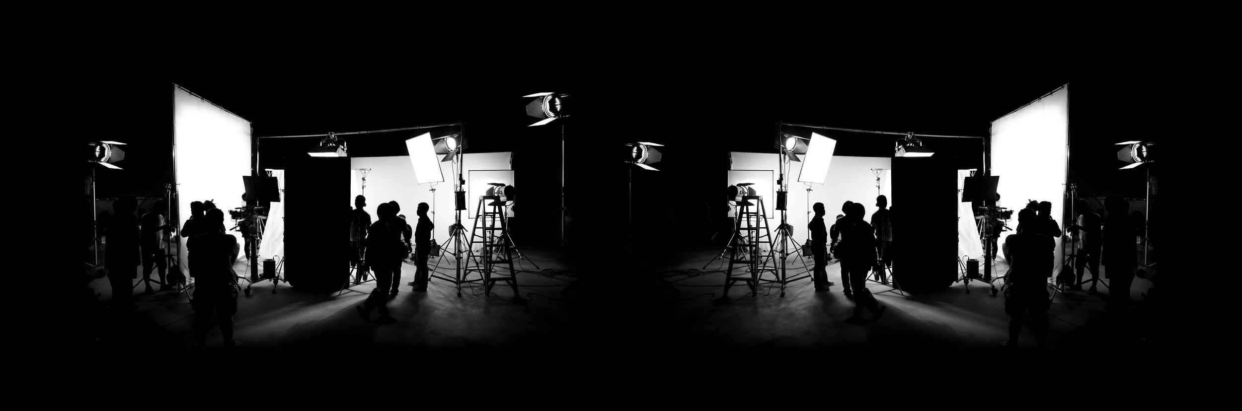 silhouettes-working-on-film-set-with-studio-lights-2026-03-24-11-19-34-utc.jpg