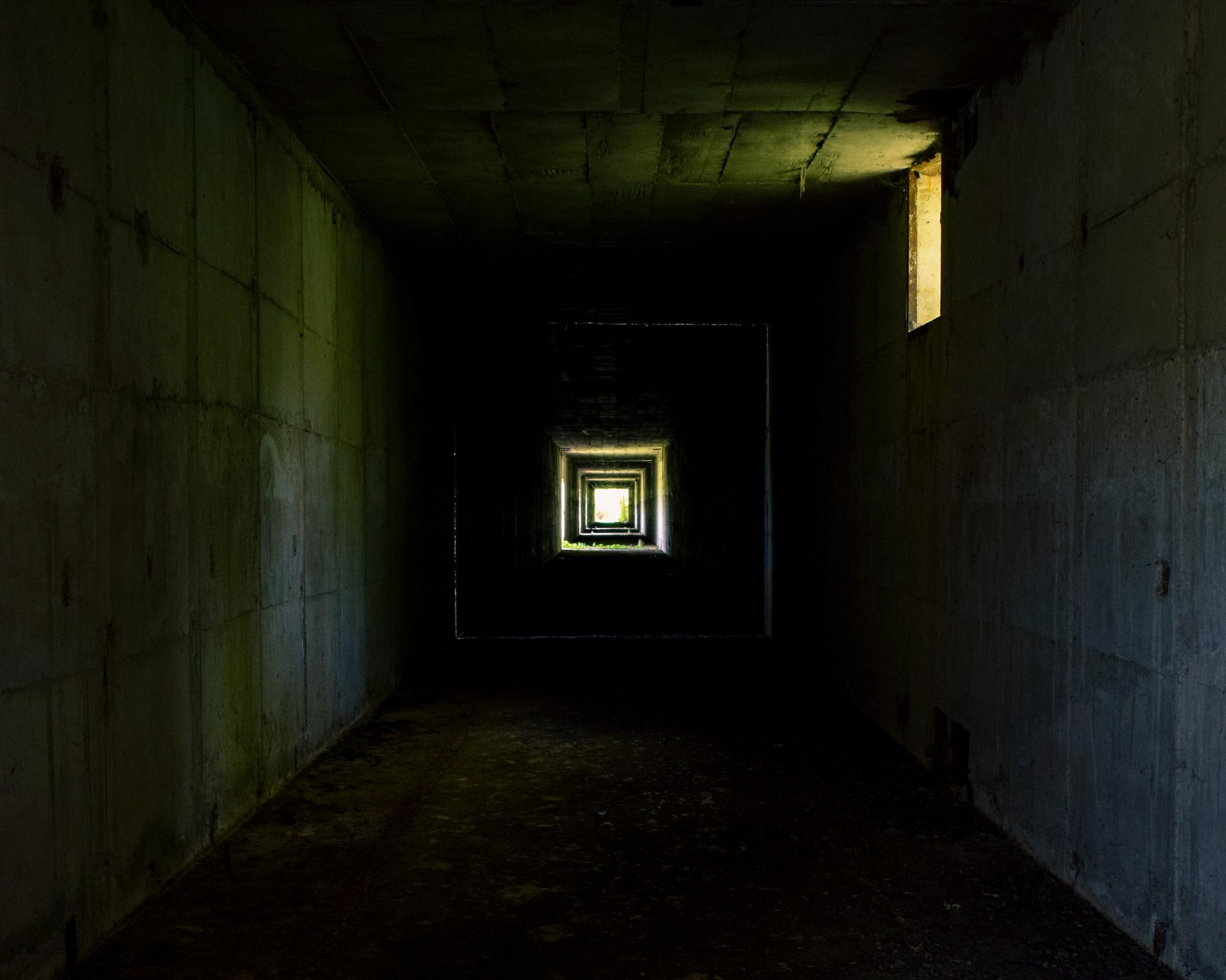 dim-concrete-tunnel-with-light-at-end-2026-01-08-00-23-04-utc.jpeg