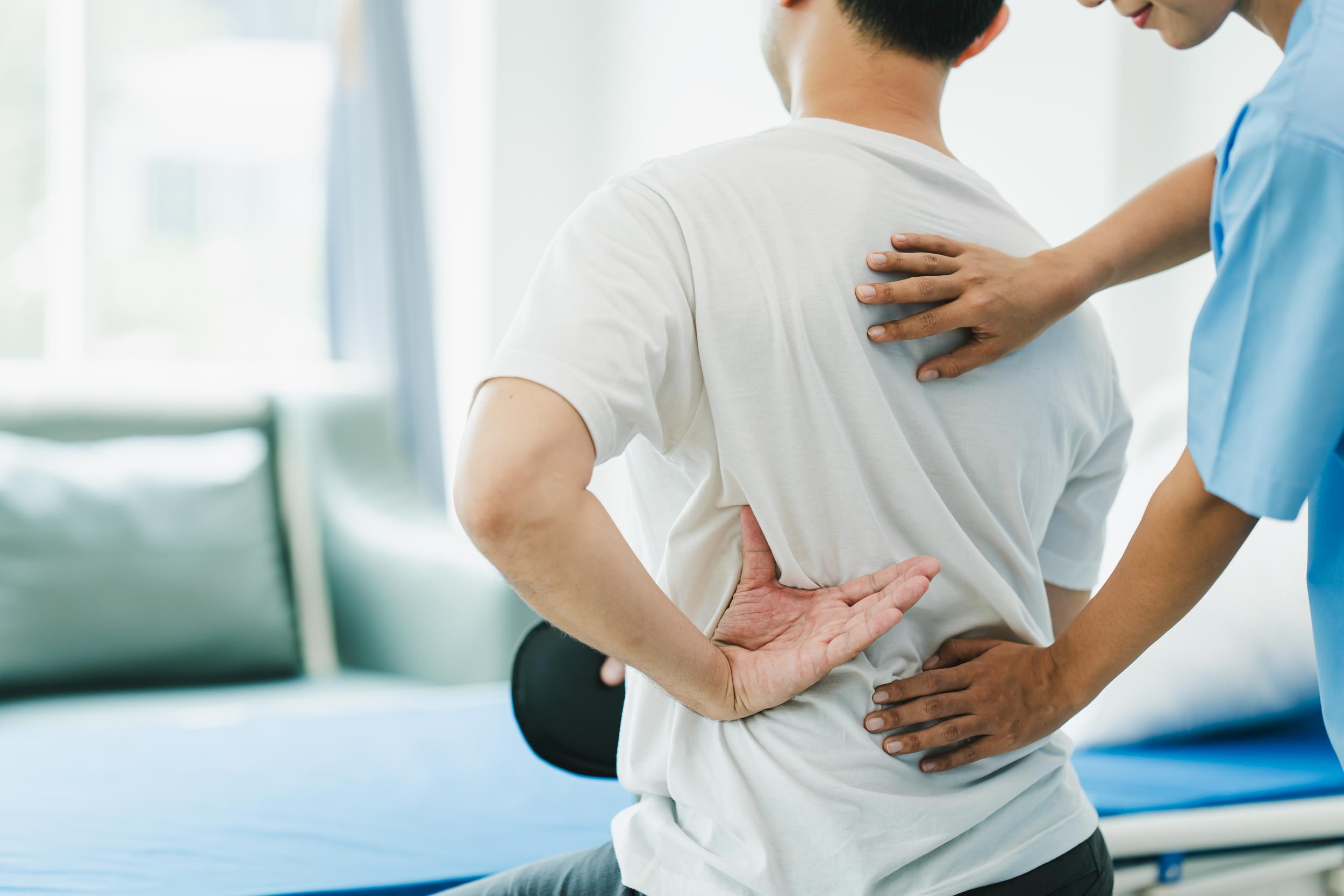 man-receiving-back-treatment-from-medical-professi-2026-01-08-06-30-14-utc.jpg