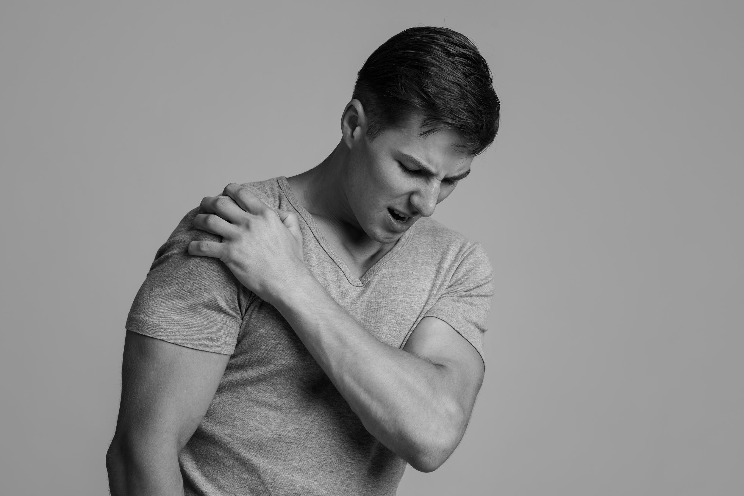 man-experiencing-shoulder-pain-in-a-grey-studio-2026-03-24-02-19-55-utc.jpg