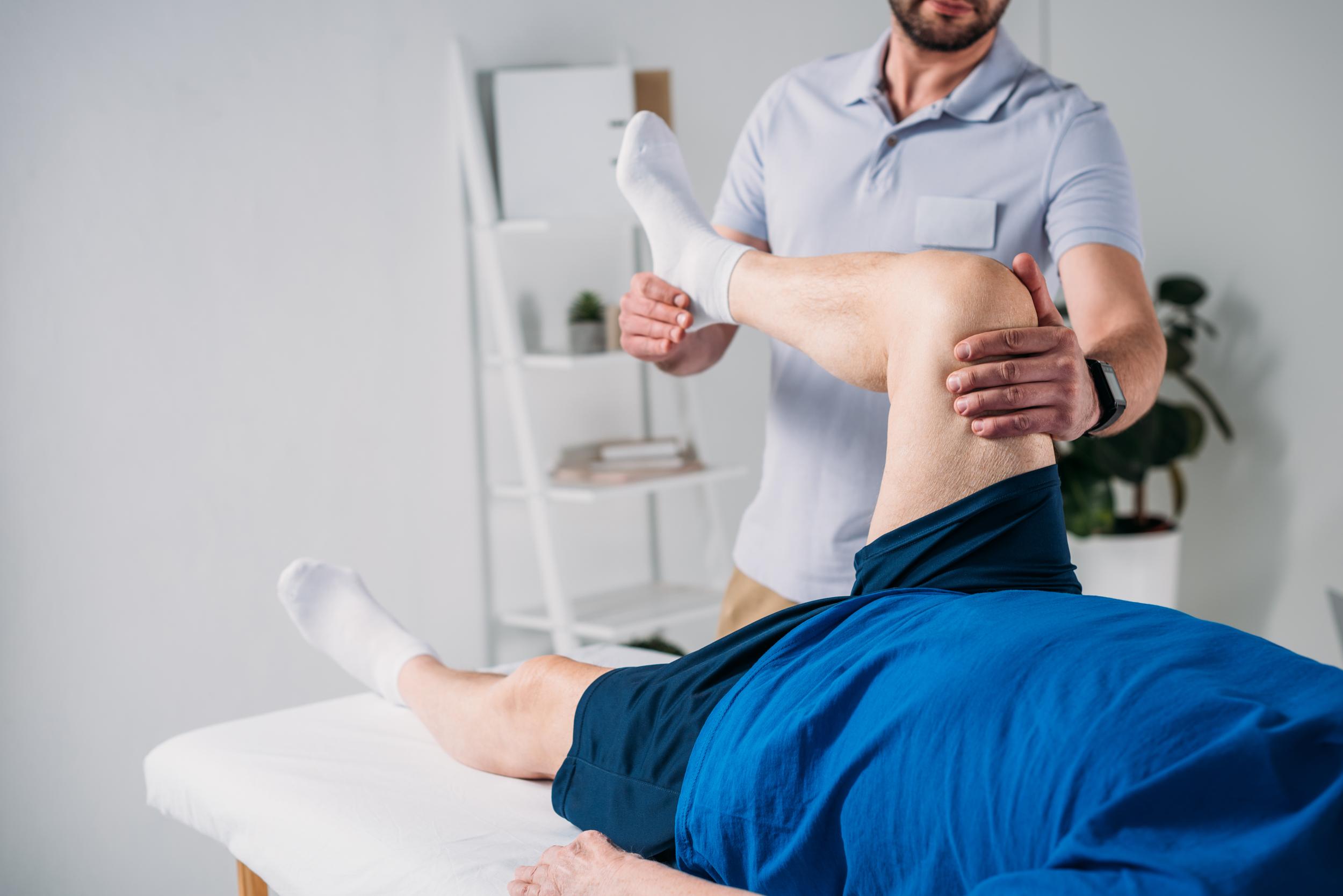 partial-view-of-rehabilitation-therapist-massaging-2026-03-12-22-47-20-utc.jpg