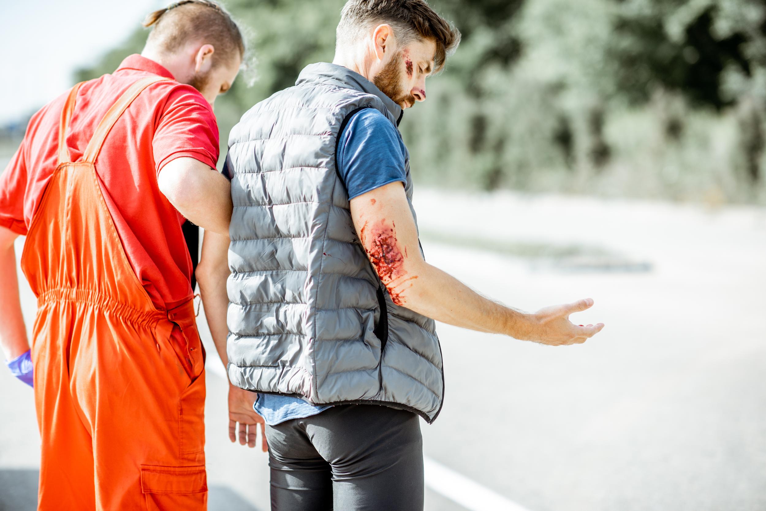 injured-man-receiving-assistance-outdoors-on-brigh-2026-03-25-00-03-28-utc.jpg