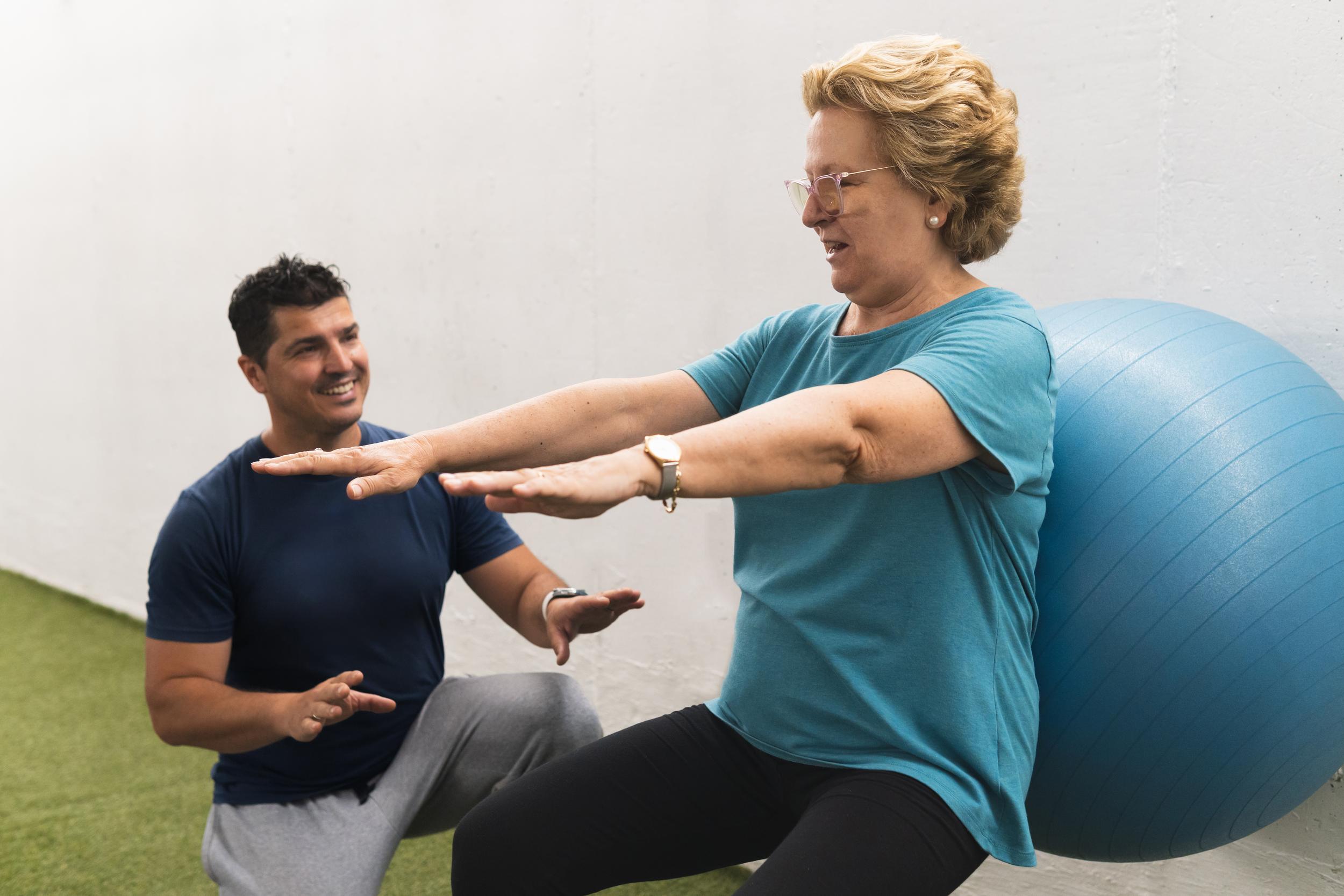 woman-working-out-with-personal-trainer-at-gym-2026-03-26-09-04-16-utc.jpg