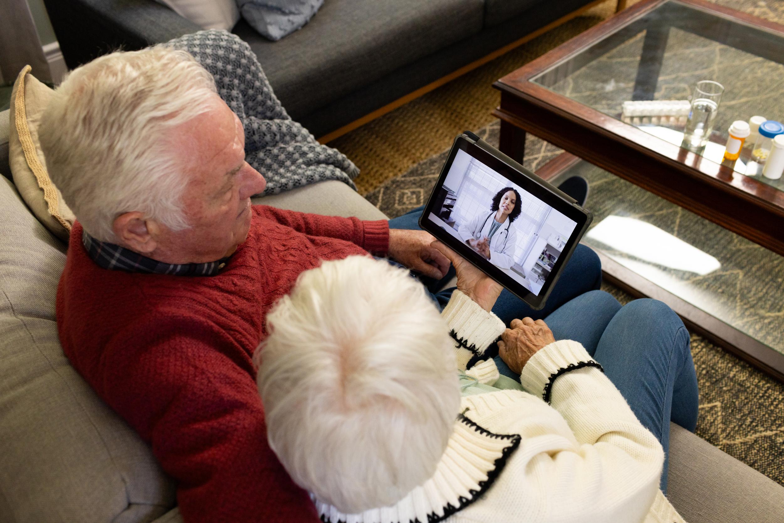 senior-couple-telehealth-consult-on-the-sofa-2026-01-09-08-43-49-utc.jpg