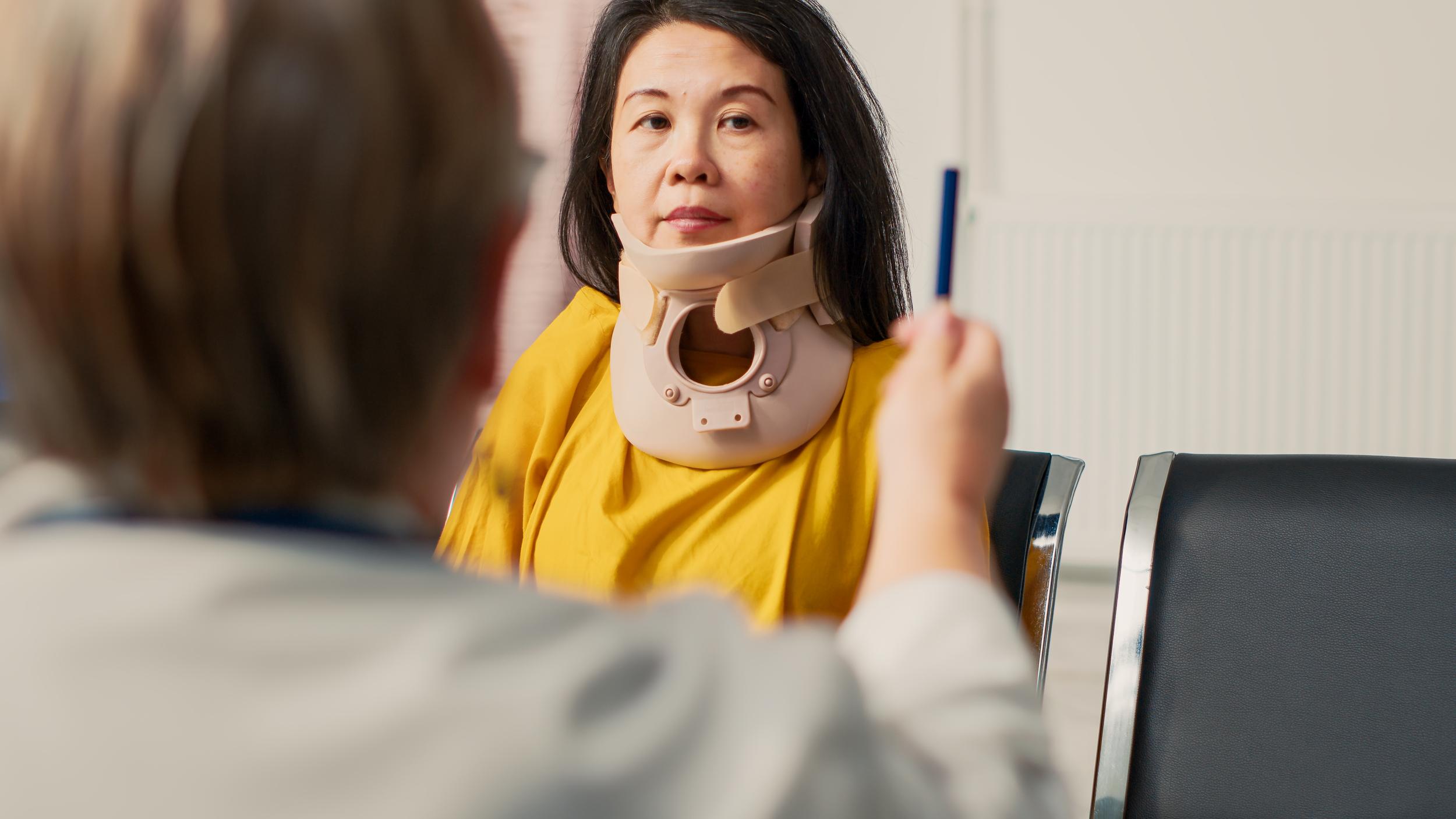 adult-woman-wearing-neck-brace-at-medical-appointm-2026-03-19-01-45-06-utc.jpg