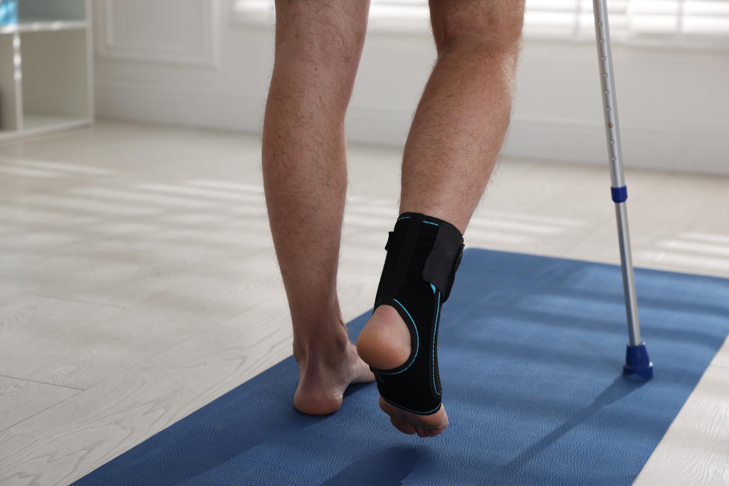 man-s-ankle-support-with-crutch-on-blue-mat-2026-04-15-16-13-39-utc.jpg