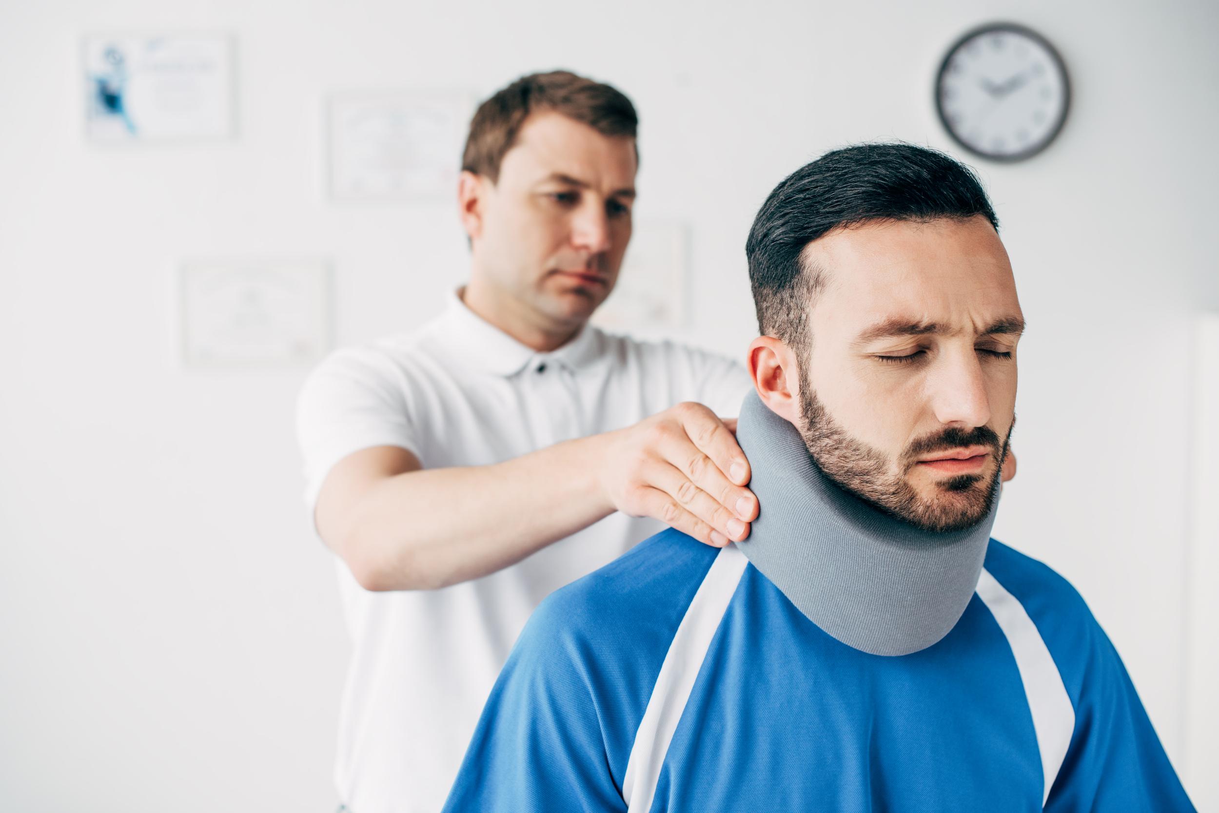 chiropractor-examining-good-looking-football-playe-2026-03-12-22-36-41-utc.jpg