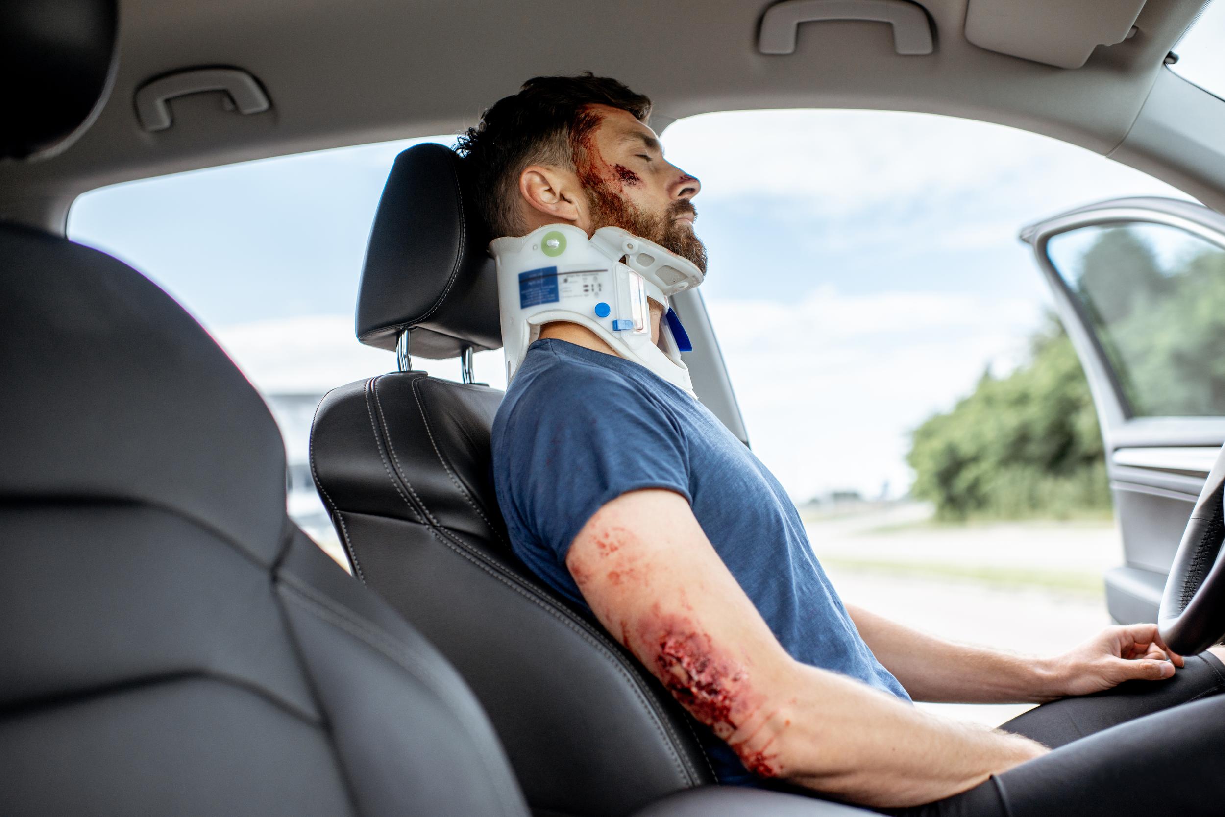 injured-man-in-car-wearing-neck-brace-2026-03-24-13-46-27-utc.jpg