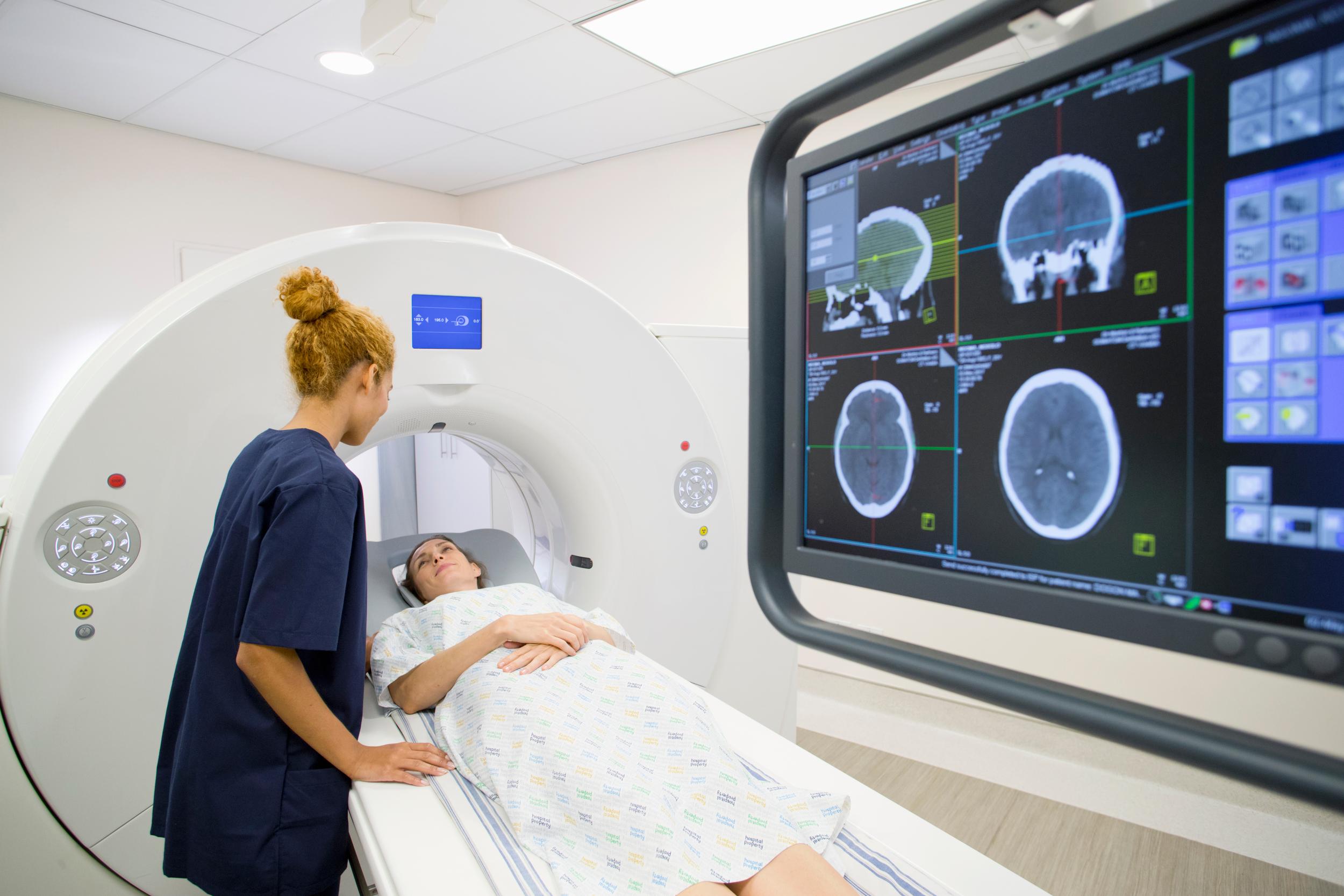 hospital-radiographer-with-female-patient-operatin-2026-03-26-09-42-23-utc.jpg