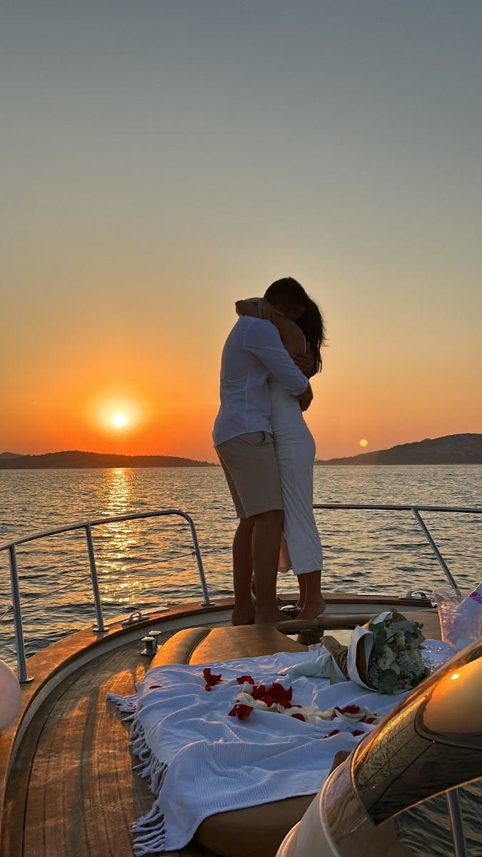Private yacht with decorated table at sunset