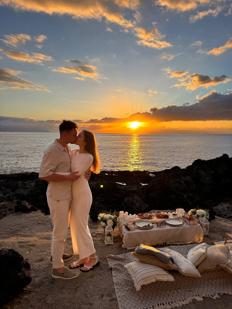 Romantic picnic at sunset by the ocean in Tenerife