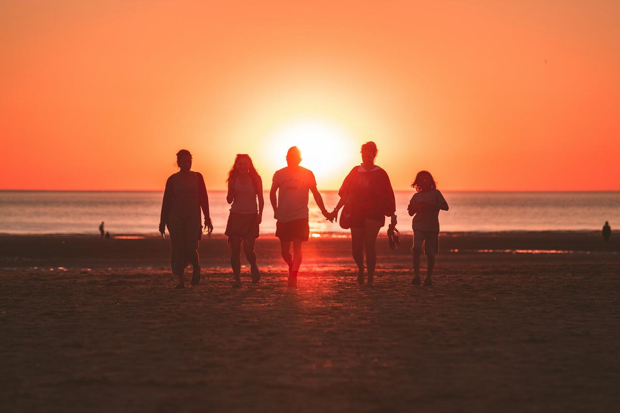I was randomly shooting the sunset when a family decided to walk back from the sea to the beach, I was just perfectly aligned with them and the golden hour sun. Captured the cute moment where the mother and father were holding hands. They noticed me afterwards and they asked if I had an instagram so they could see my work. We had a little chat and I showed the fresh photo directly on my camera screen, they were really happy with it !
I love the tones and how the backlight enhances group.