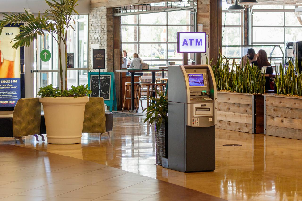 An ATM positioned in a mall. Considering how to get an ATM machine installed is the surest way to increase profits.