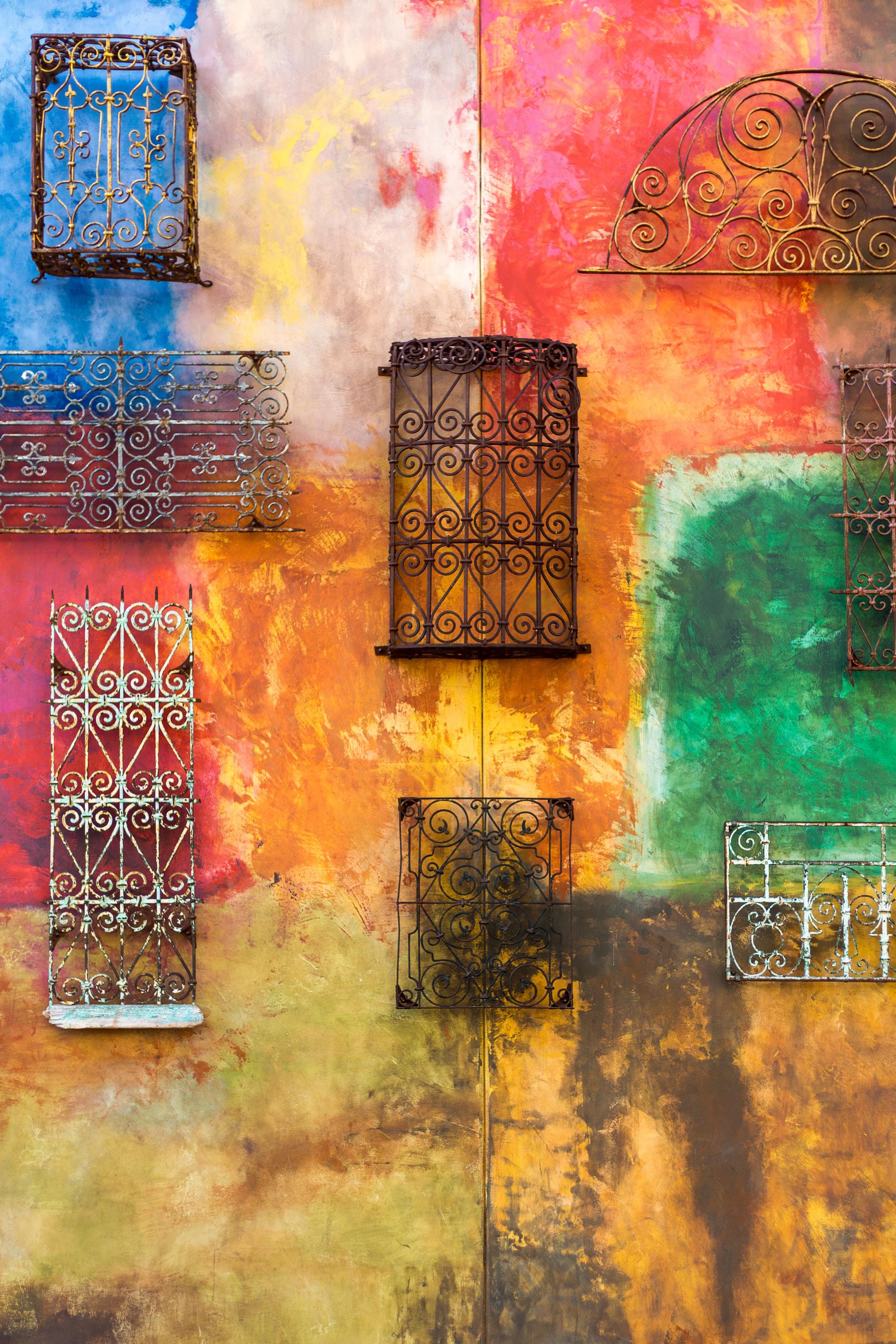 Metal gates on colored wall