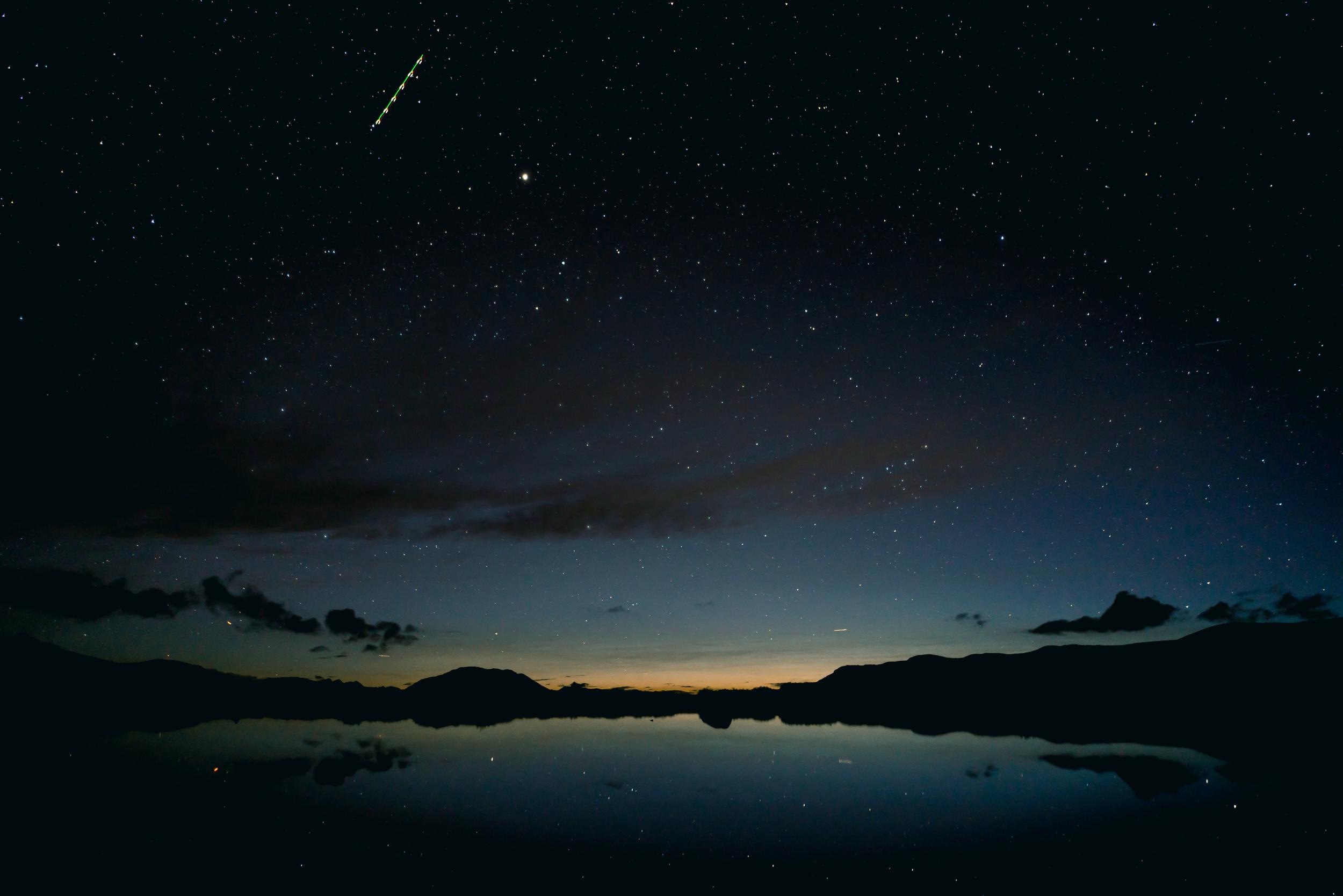 beautiful-silhouette-shot-of-mountains-by-the-rive-2025-02-09-18-09-12-utc.jpg