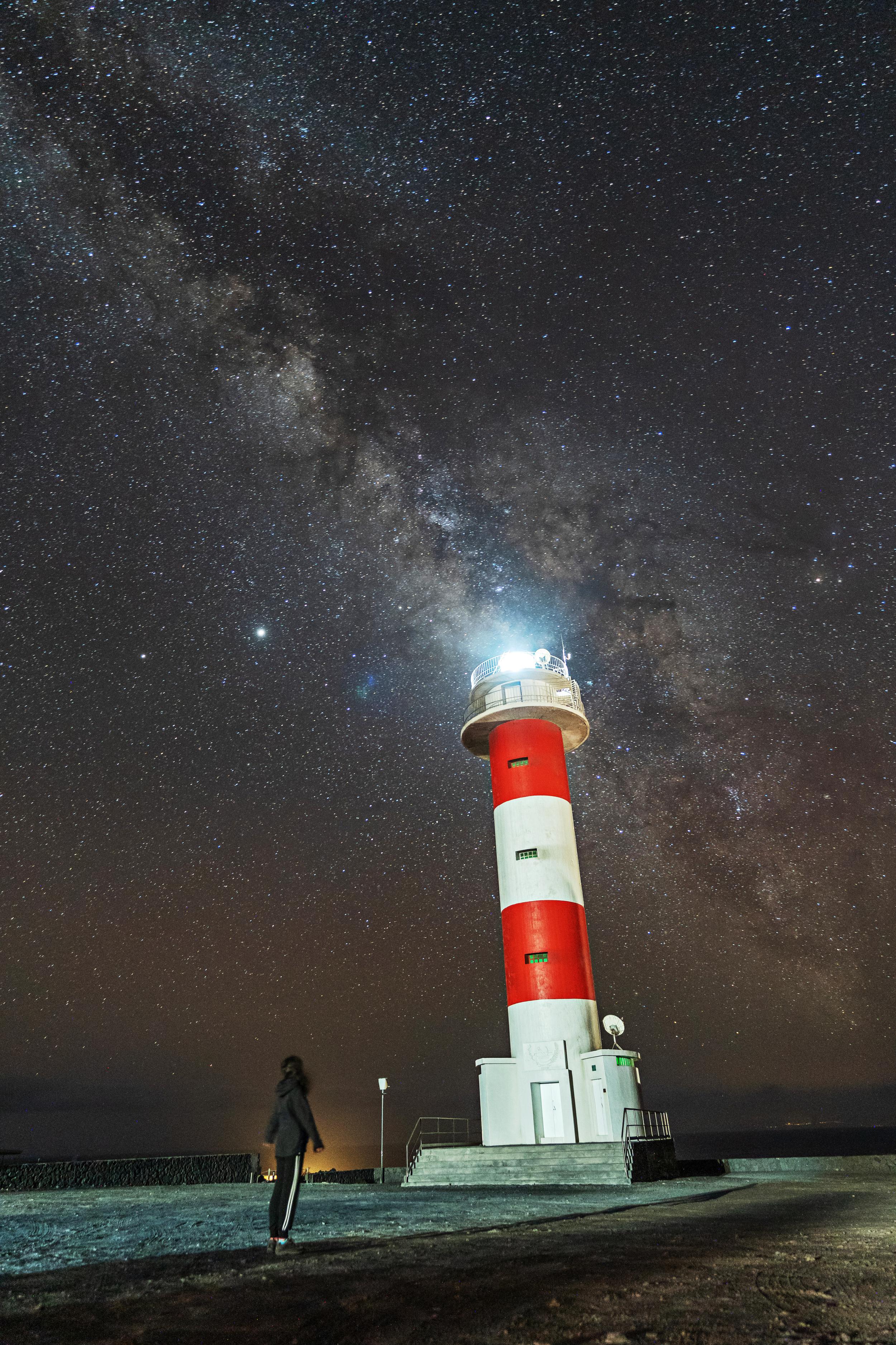 a-young-woman-at-the-fuencaliente-lighthouse-with-2024-12-09-01-25-15-utc.jpg