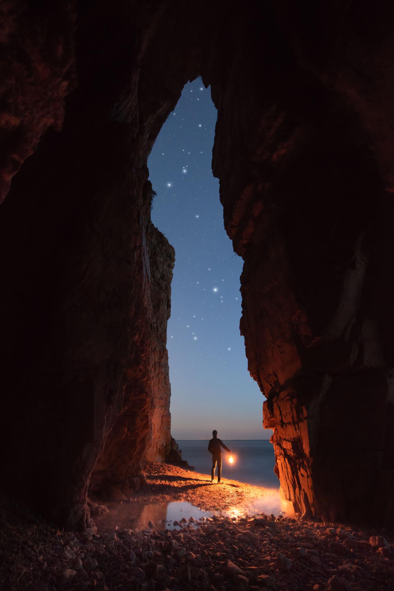man-enjoying-the-starry-sky-view-from-a-cave-2025-02-09-17-41-30-utc.jpg