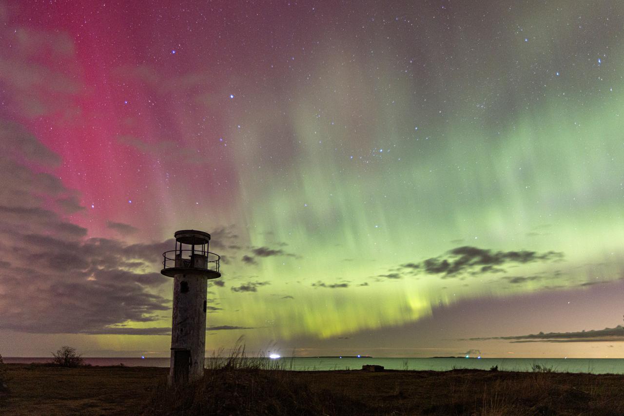 lighthouse-situated-on-the-beach-with-a-beautiful-2025-02-09-00-11-41-utc.jpg