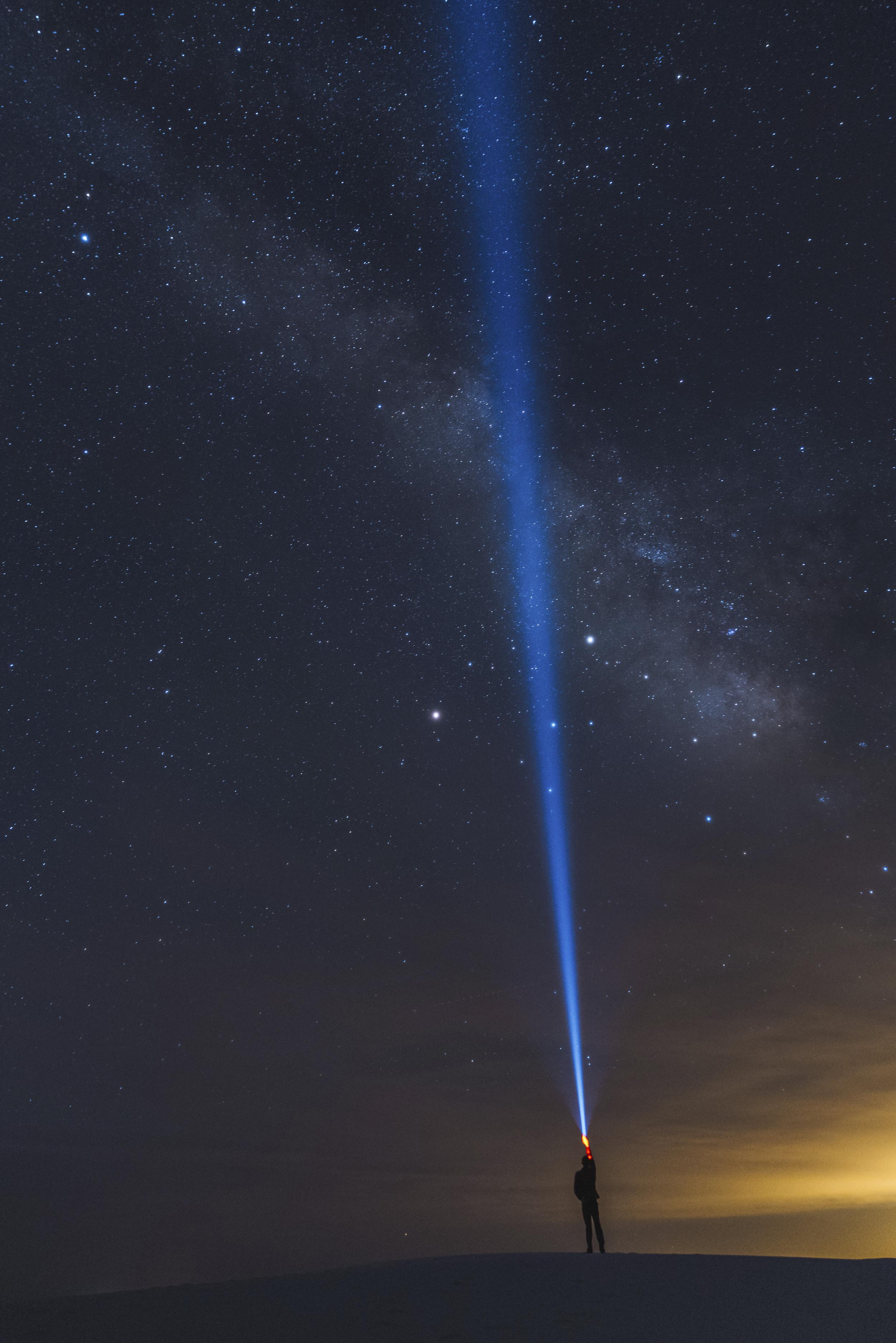 a-lone-explorer-beams-light-into-the-night-sky-und-2025-04-03-15-38-54-utc.jpg