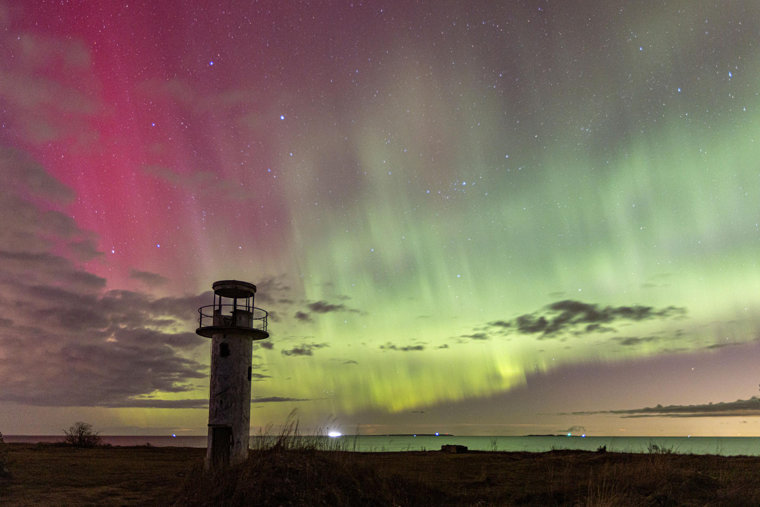 lighthouse-situated-on-the-beach-with-a-beautiful-2025-02-09-00-11-41-utc.jpg