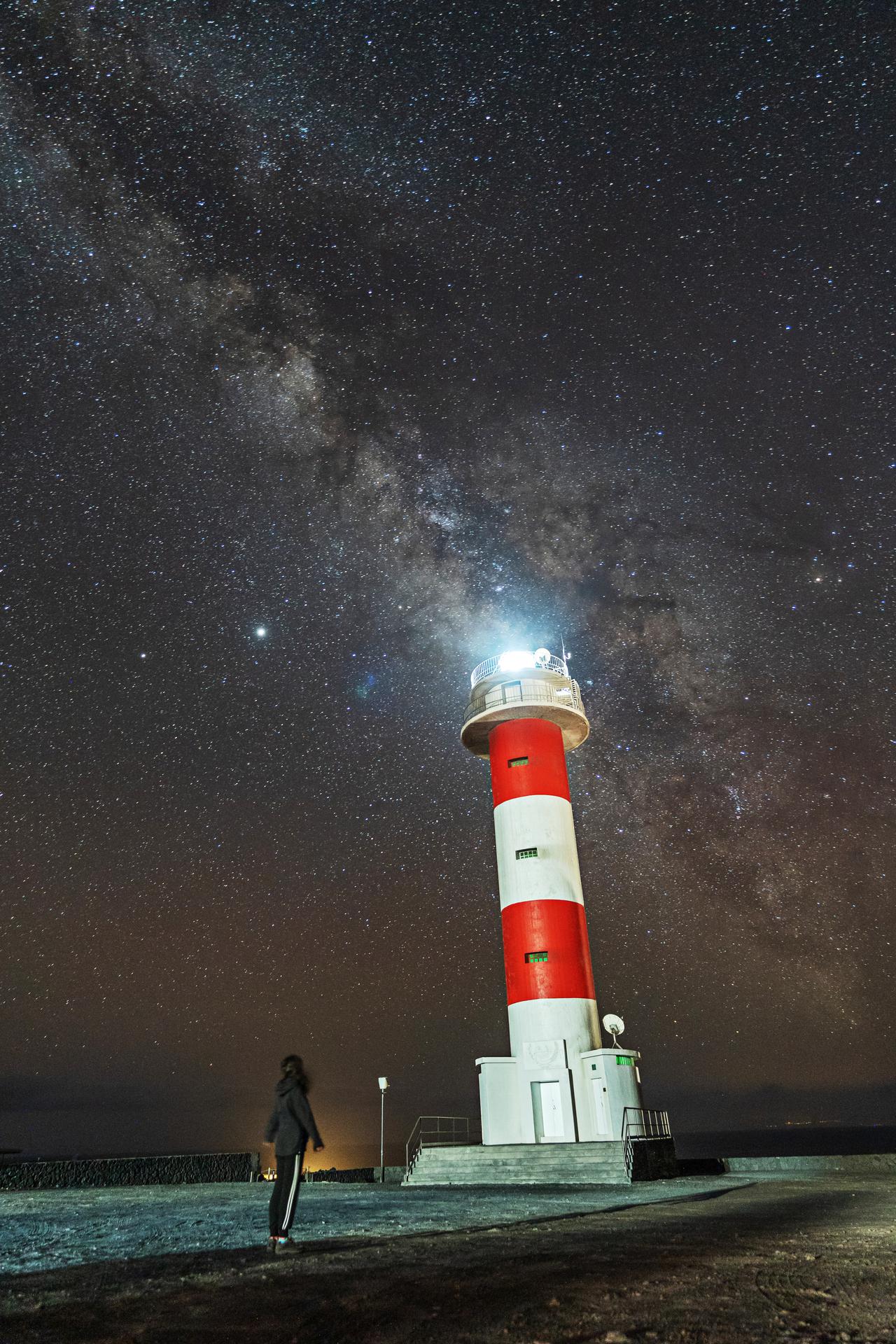 a-young-woman-at-the-fuencaliente-lighthouse-with-2024-12-09-01-25-15-utc.jpg