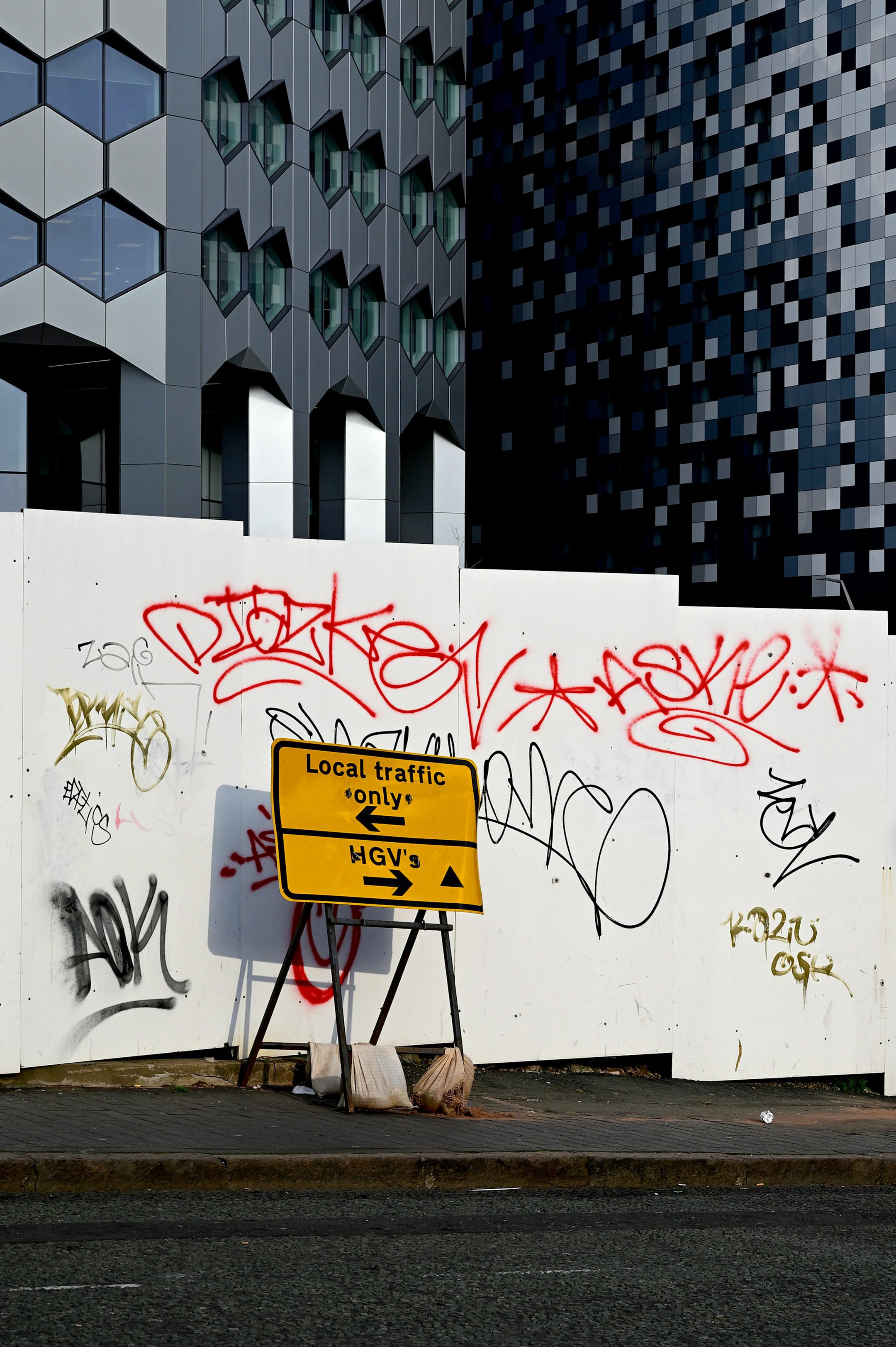 Yellow sign. Construction site. It is all about the contrasts...