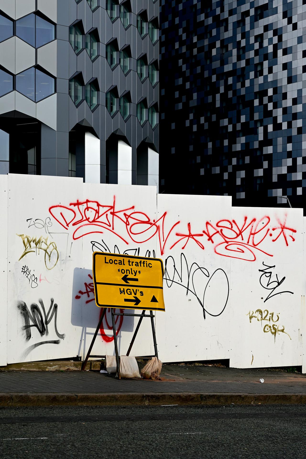 Yellow sign. Construction site. It is all about the contrasts...