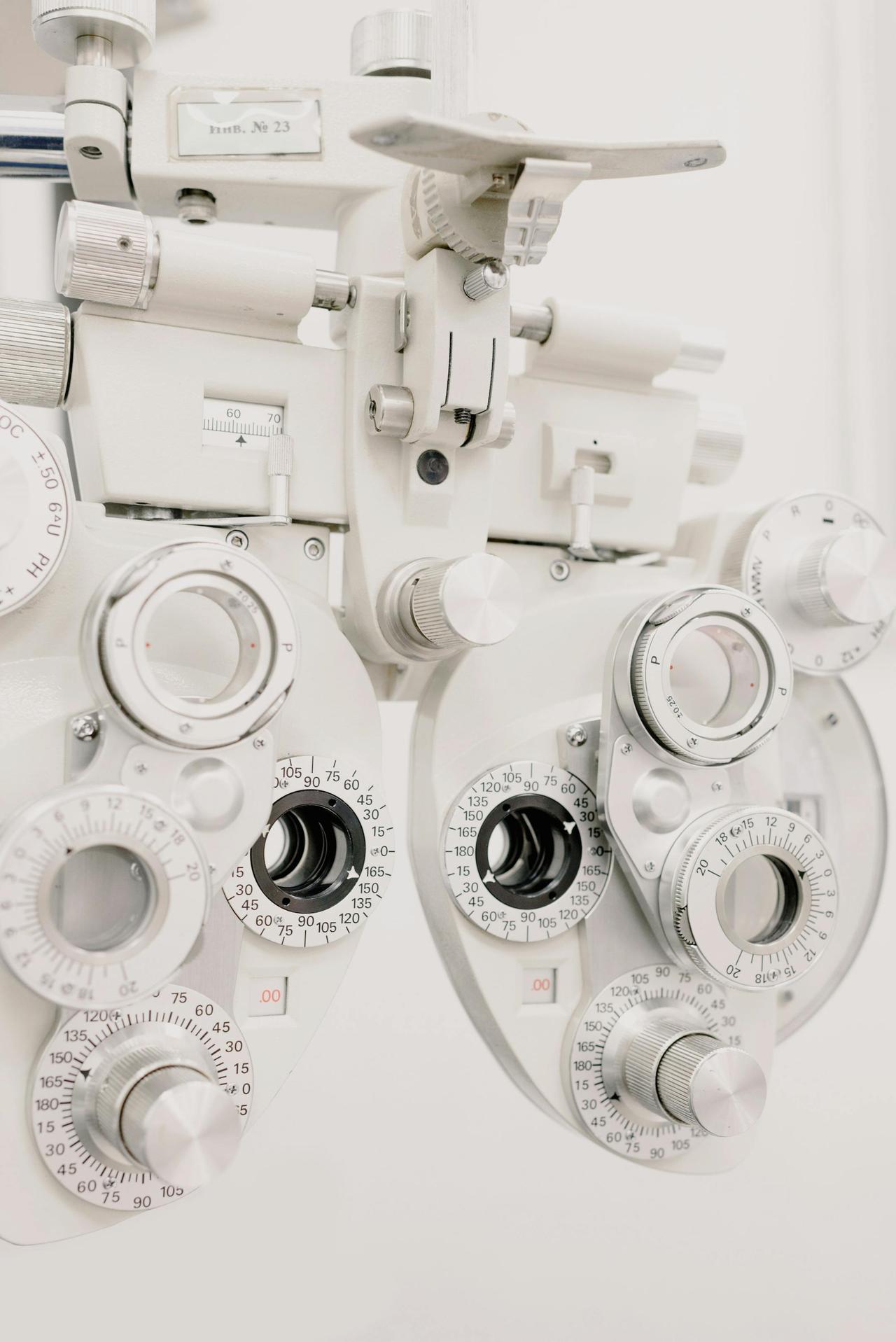 Detailed view of a phoropter used for eye exams in a modern optometry clinic.
