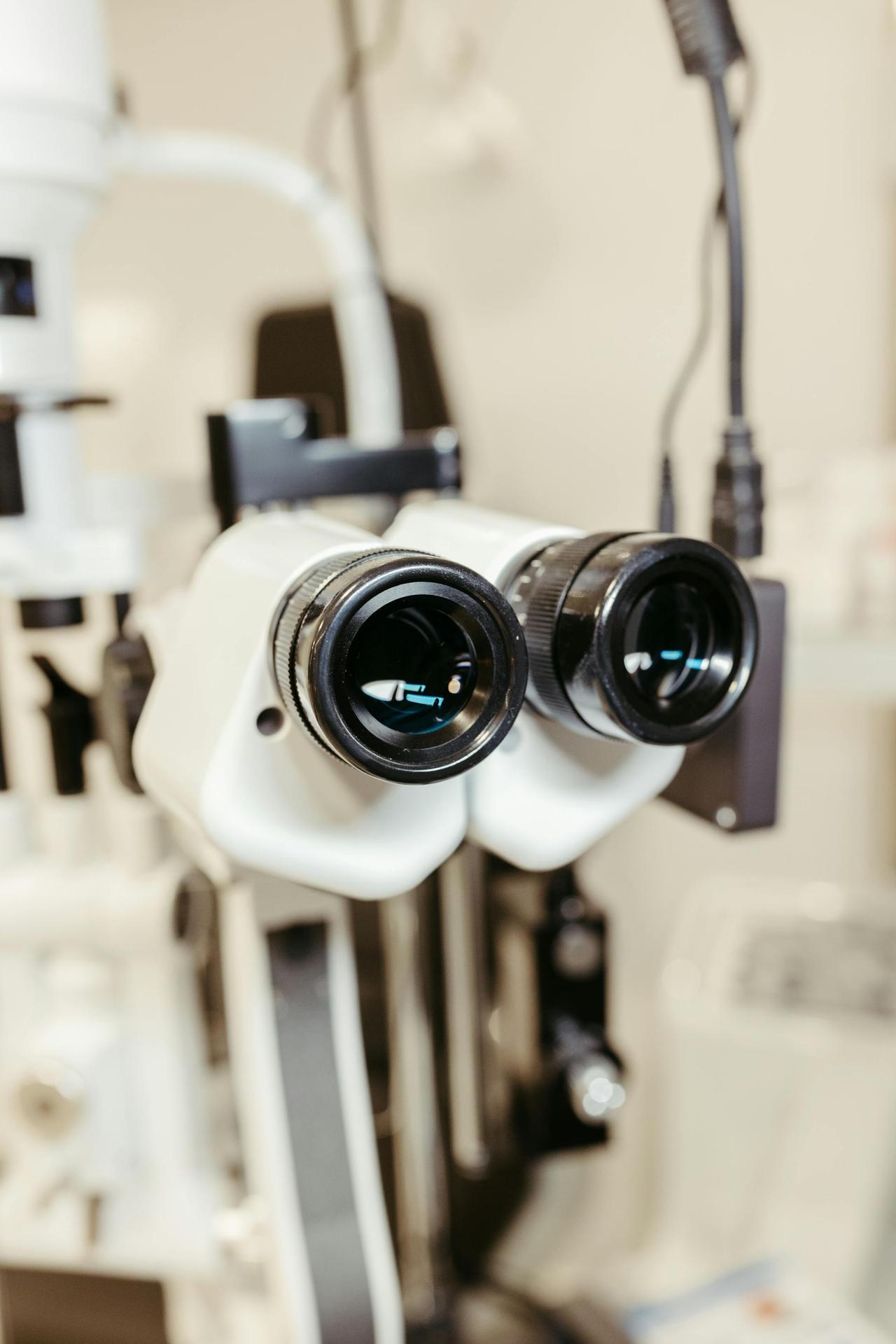 Close-up of binocular eye examination device used in optometry and ophthalmology clinics.