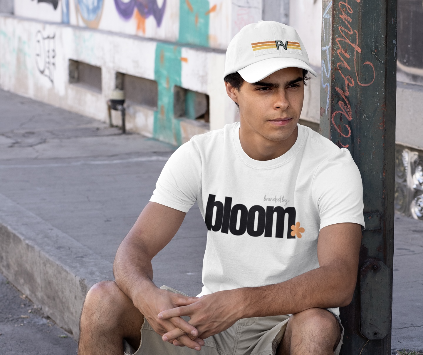 t-shirt-mockup-featuring-a-young-man-wearing-a-dad-hat-in-an-urban-setting-cropped.png