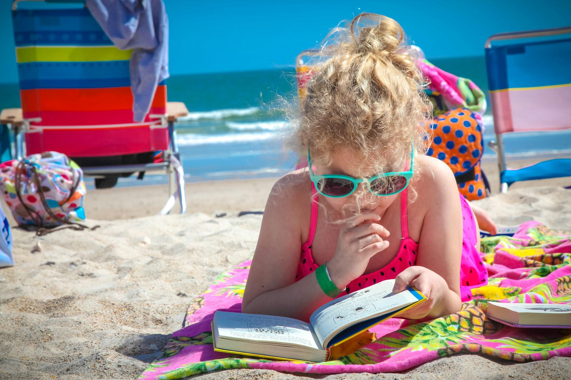 Girl reading at the beach