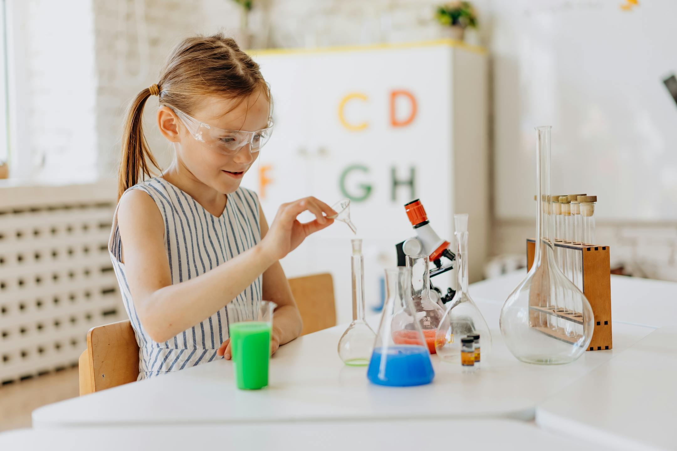 A girl performing science experiments with lab equipment, showcasing learning and curiosity.