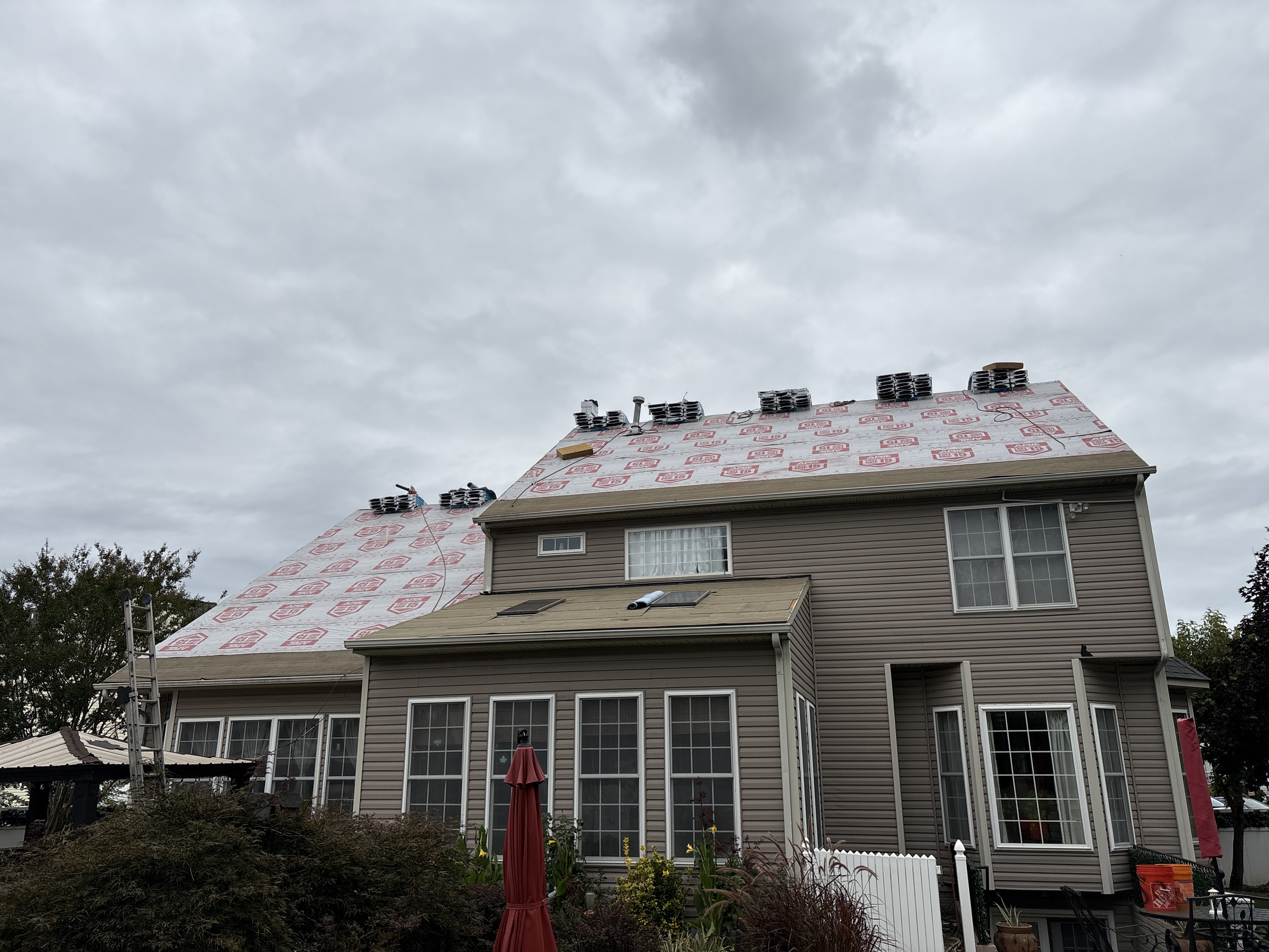 Rear roof covered in new underlayment during replacement