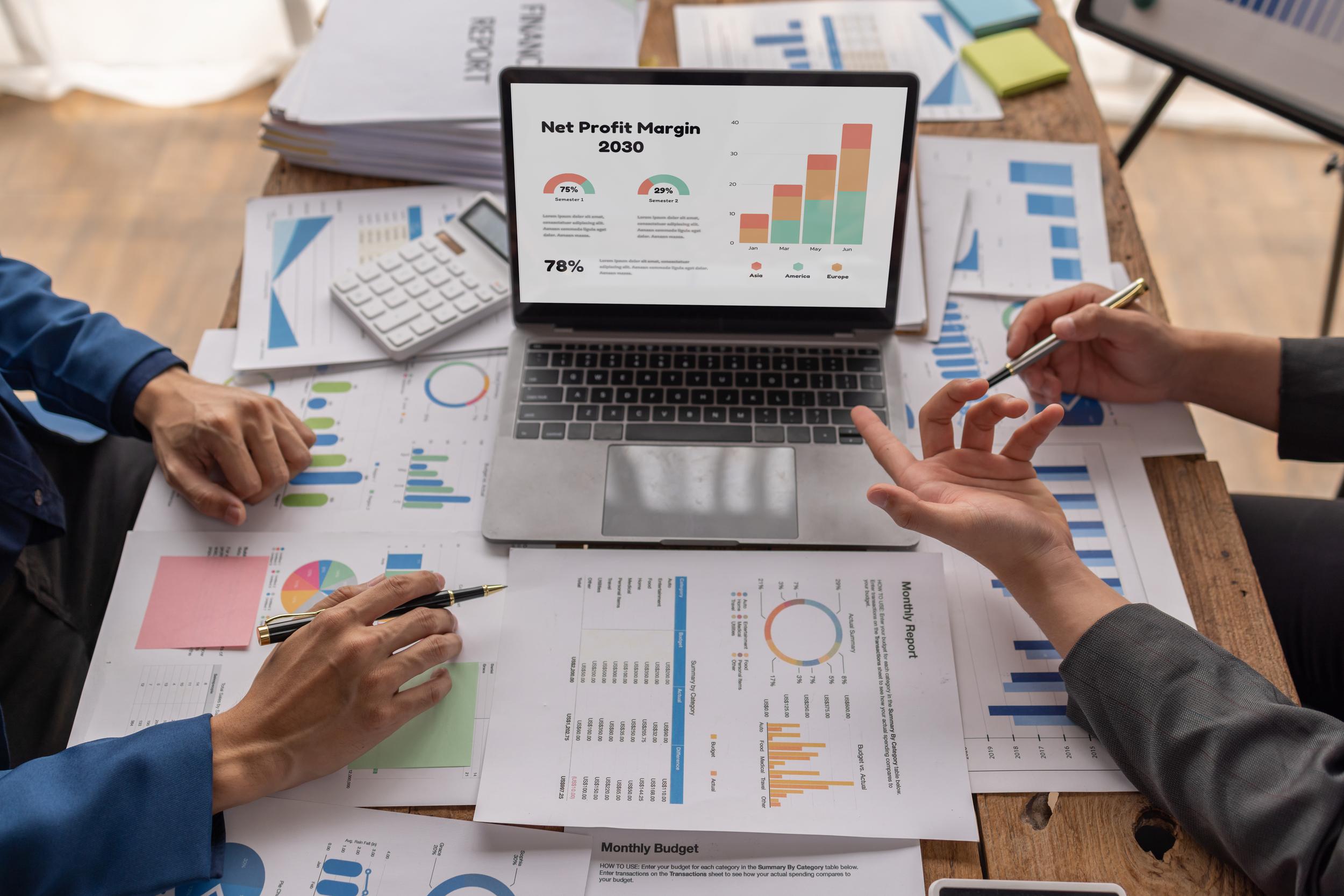 group-of-confident-business-people-point-to-graphs-2026-01-08-06-02-35-utc.jpg