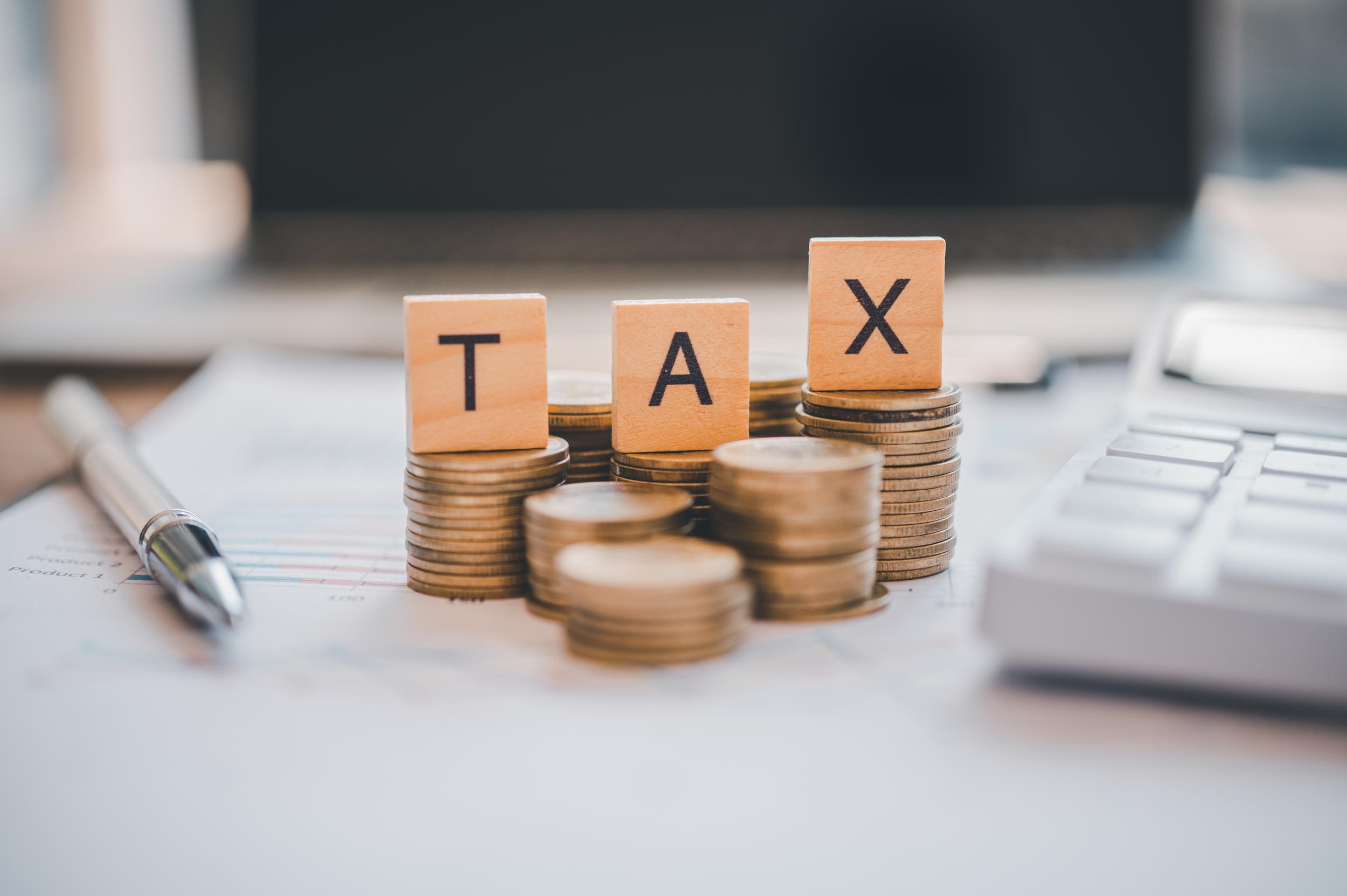 payment-and-tax-calculation-concept-wooden-blocks-2026-01-08-05-23-27-utc.jpg