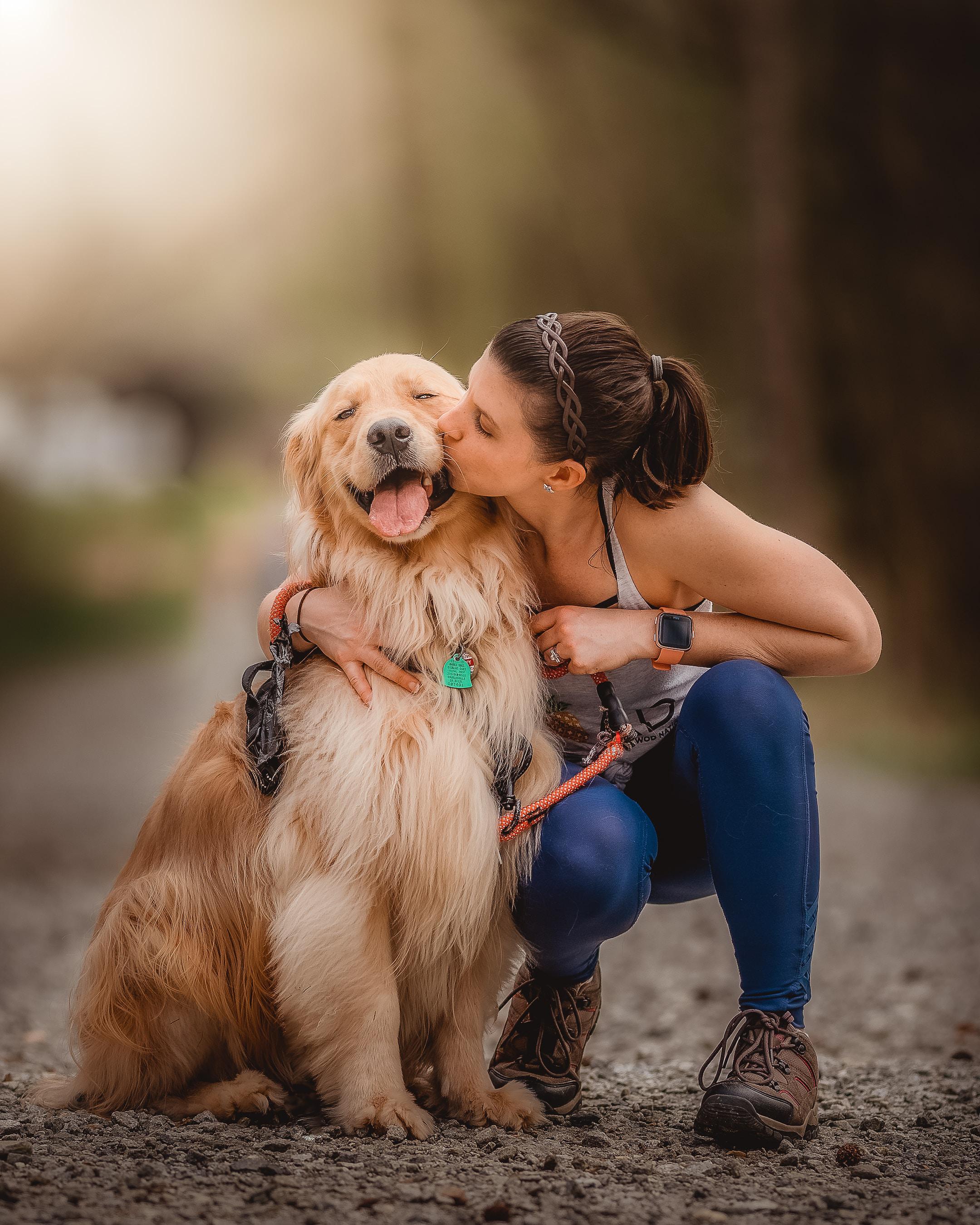 This is my beautiful wife kissing our Golden retriever Oakley. As you can see, this little boy is so happy in this moment.