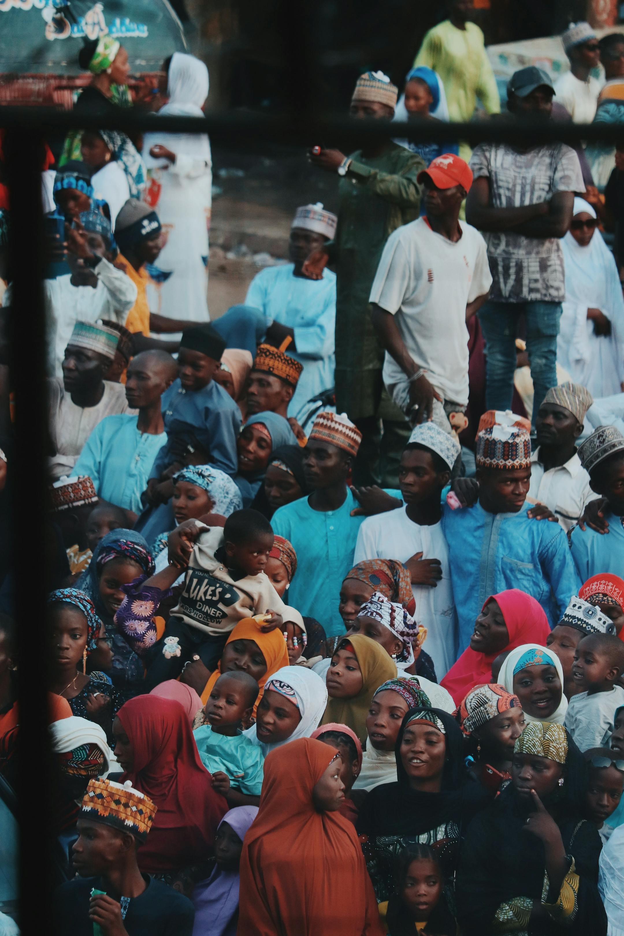 Vibrant cultural gathering showcasing diverse African community members in colorful attire.