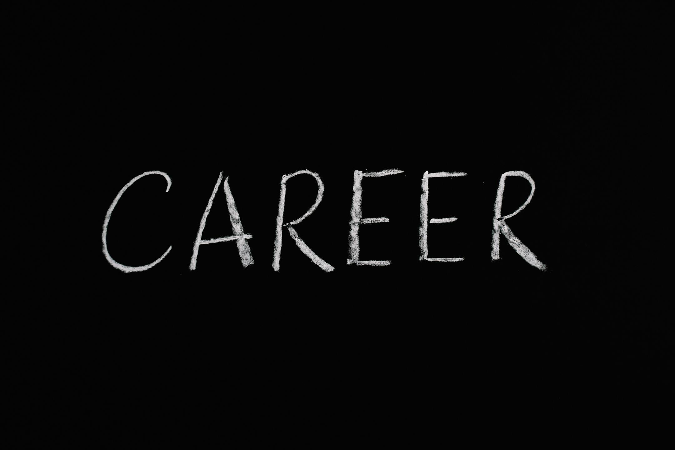 Chalk writing of 'Career' on a blackboard, symbolizing professions and jobs.