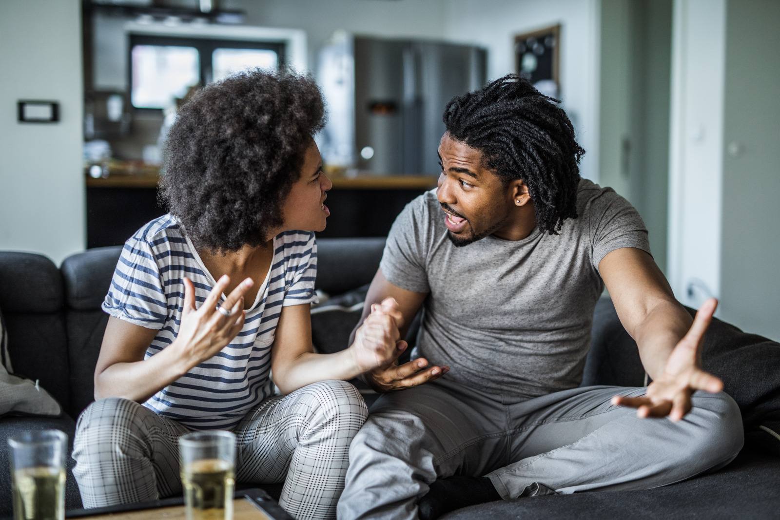 Couple having a meaningful conversation on the couch