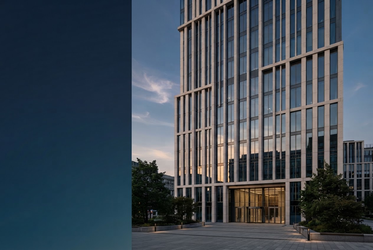 Contemporary glass and stone commercial building in soft evening light