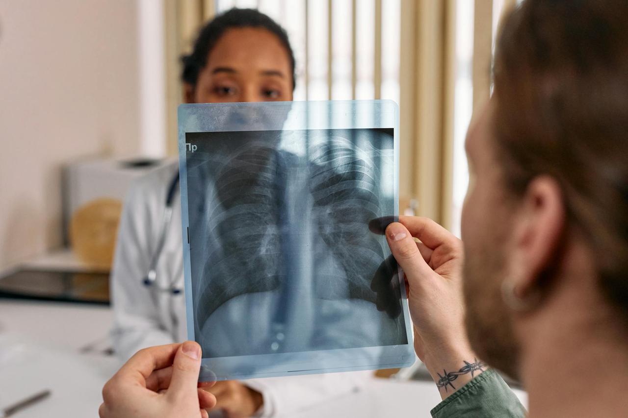 Doctor reviews chest x-ray results with patient in Tooele Valley.
