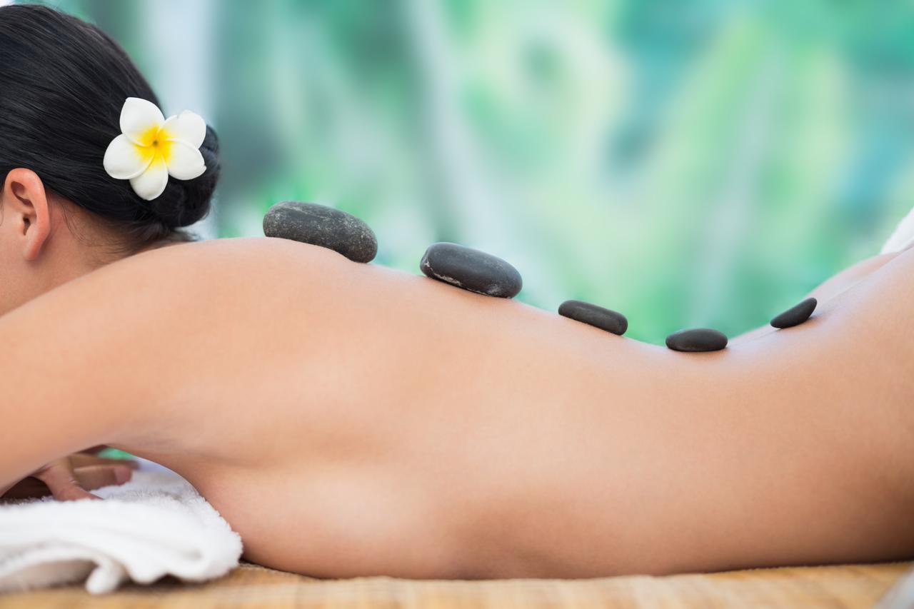 beautiful-brunette-enjoying-hot-stone-massage.jpg