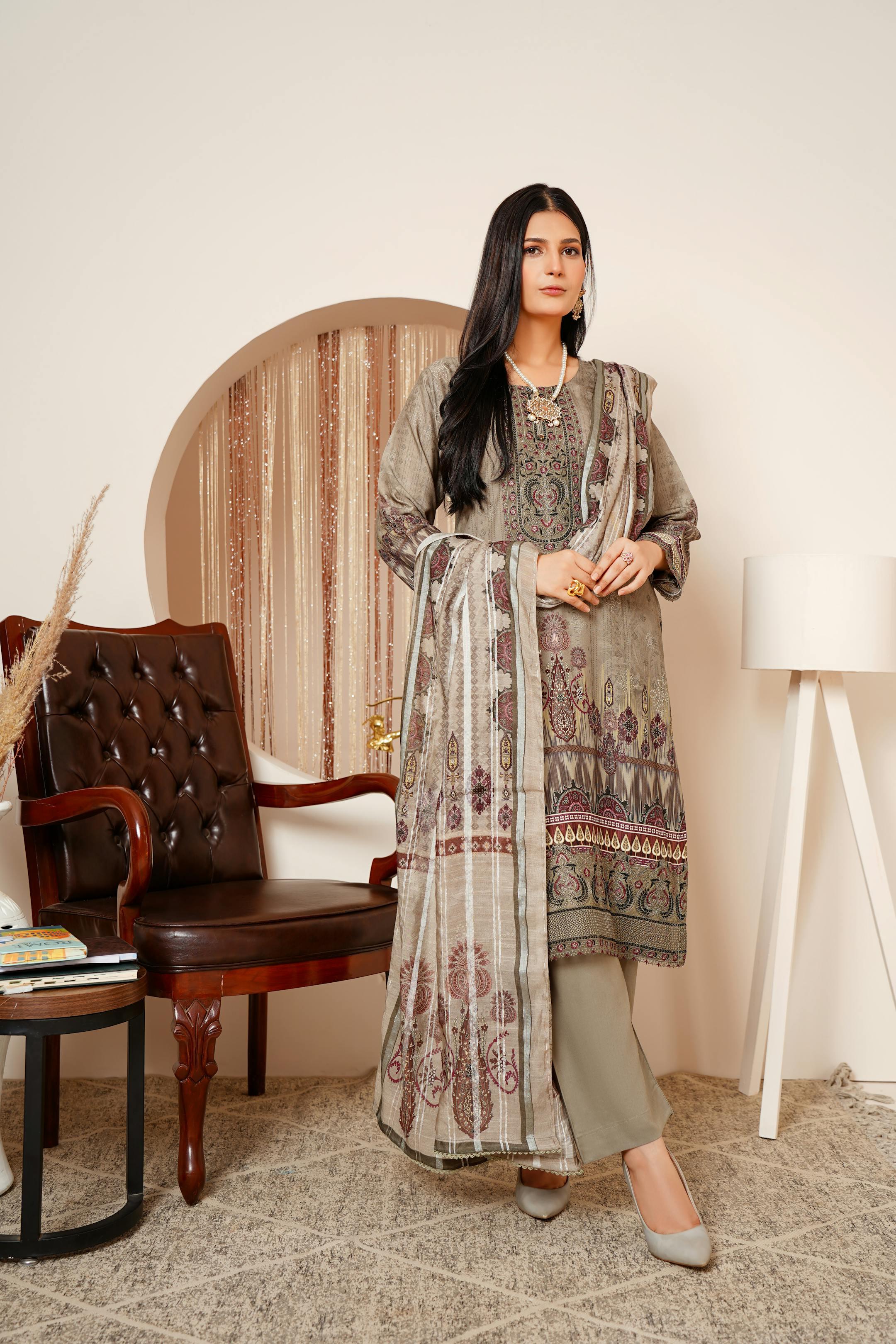 Fashionable woman in Lahore wearing traditional Pakistani garments indoors.