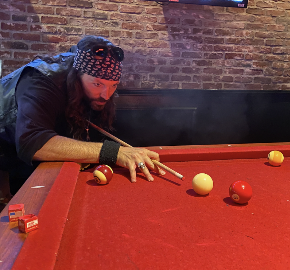 Billiard player making a strategic move