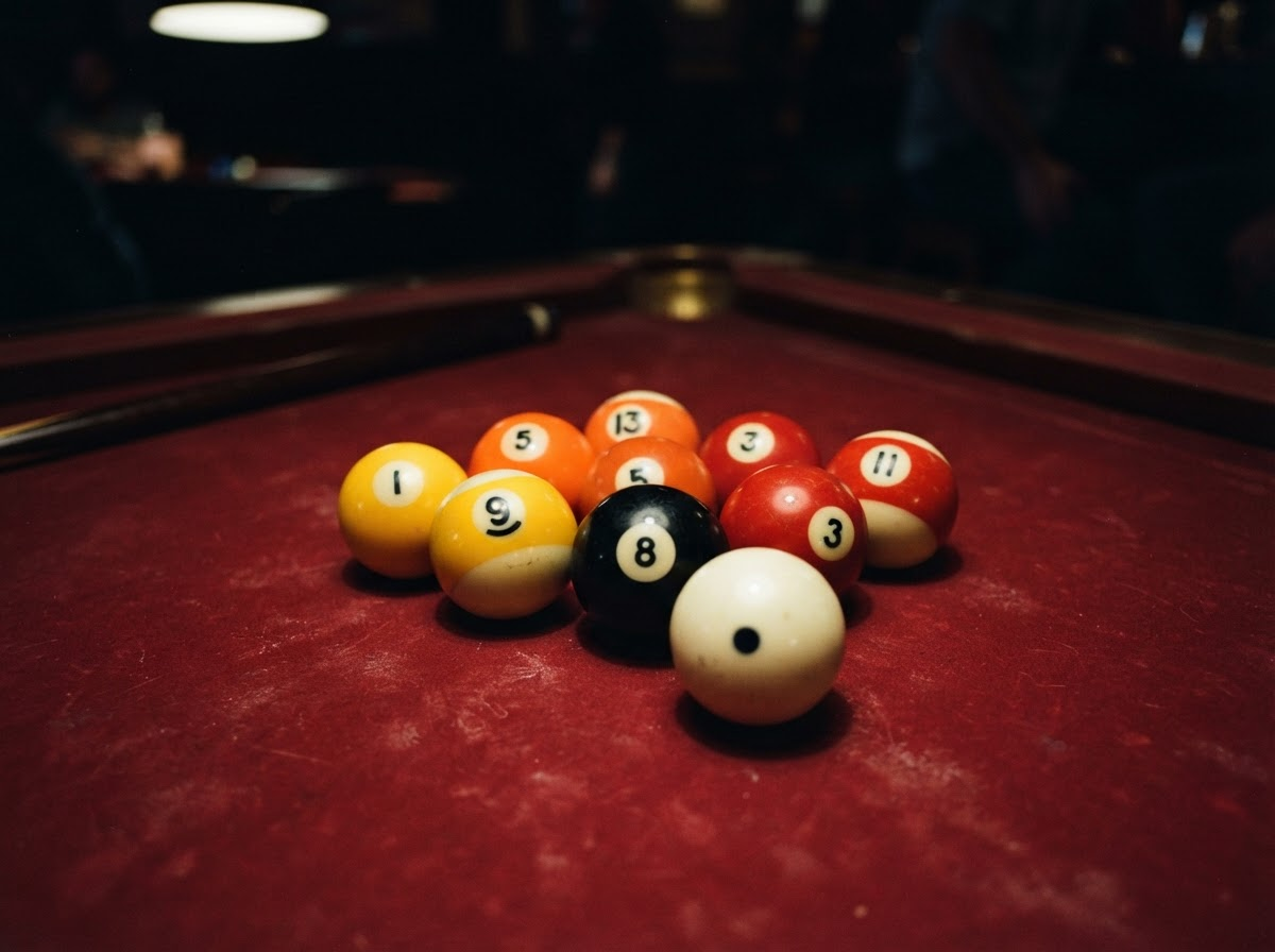Billiard balls on red felt table