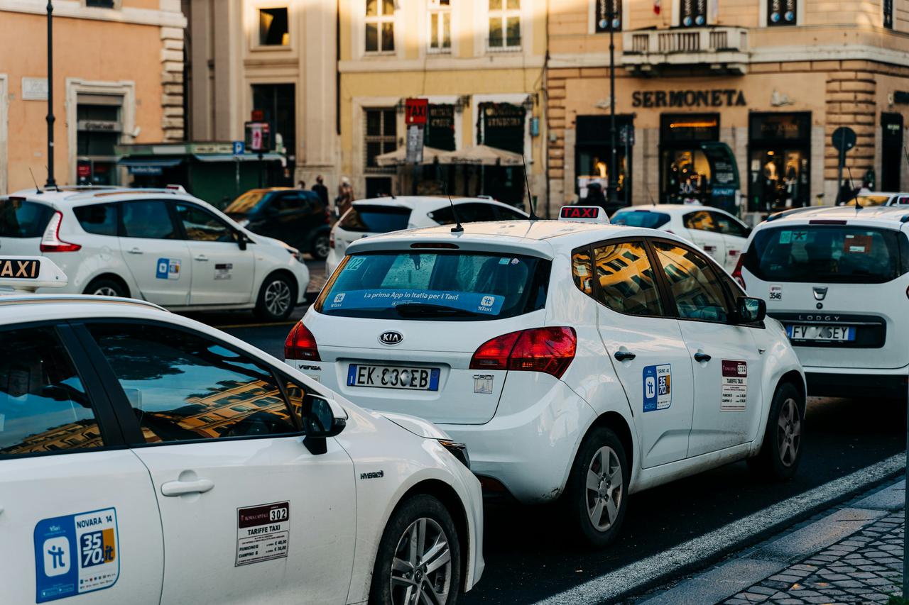 Rome, Italy: Taxi cabs waiting for customers in an empty city during Covid-19 lockdown