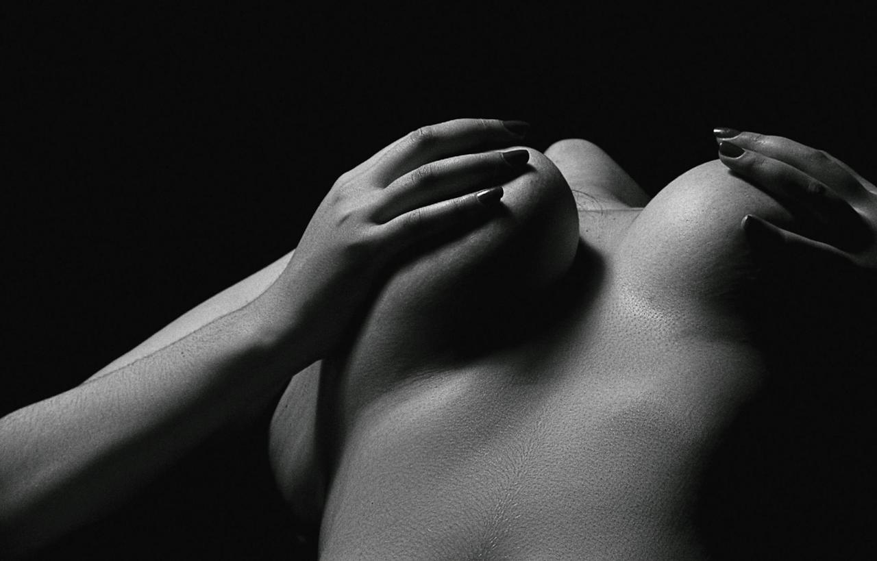 Sensual black and white artistic photograph capturing the elegance of form and texture.