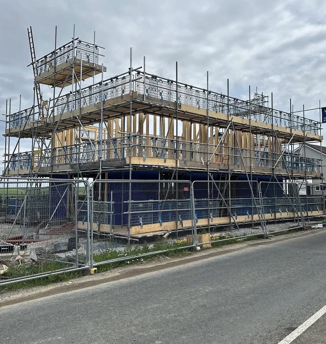 Professional scaffolding installation showing multiple levels and safety rails